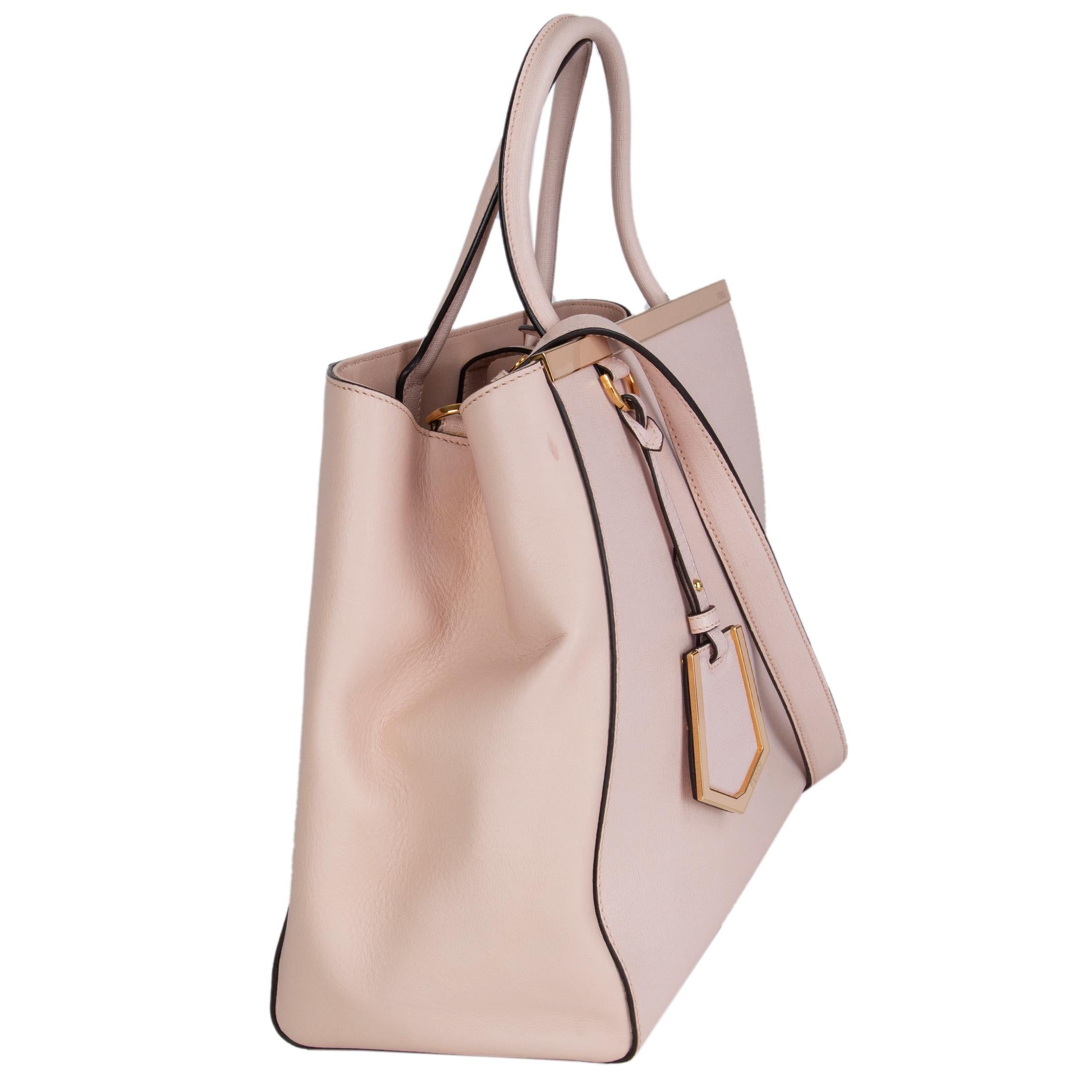 Fendi '2Jours Medium' tote in two-tone pale pink grained and smooth leather. Closes with a snap-button on top. Inside is divided into two compartements by a zipper pocket. Lined in striped logo fabric with two open pockets against the back. Has been