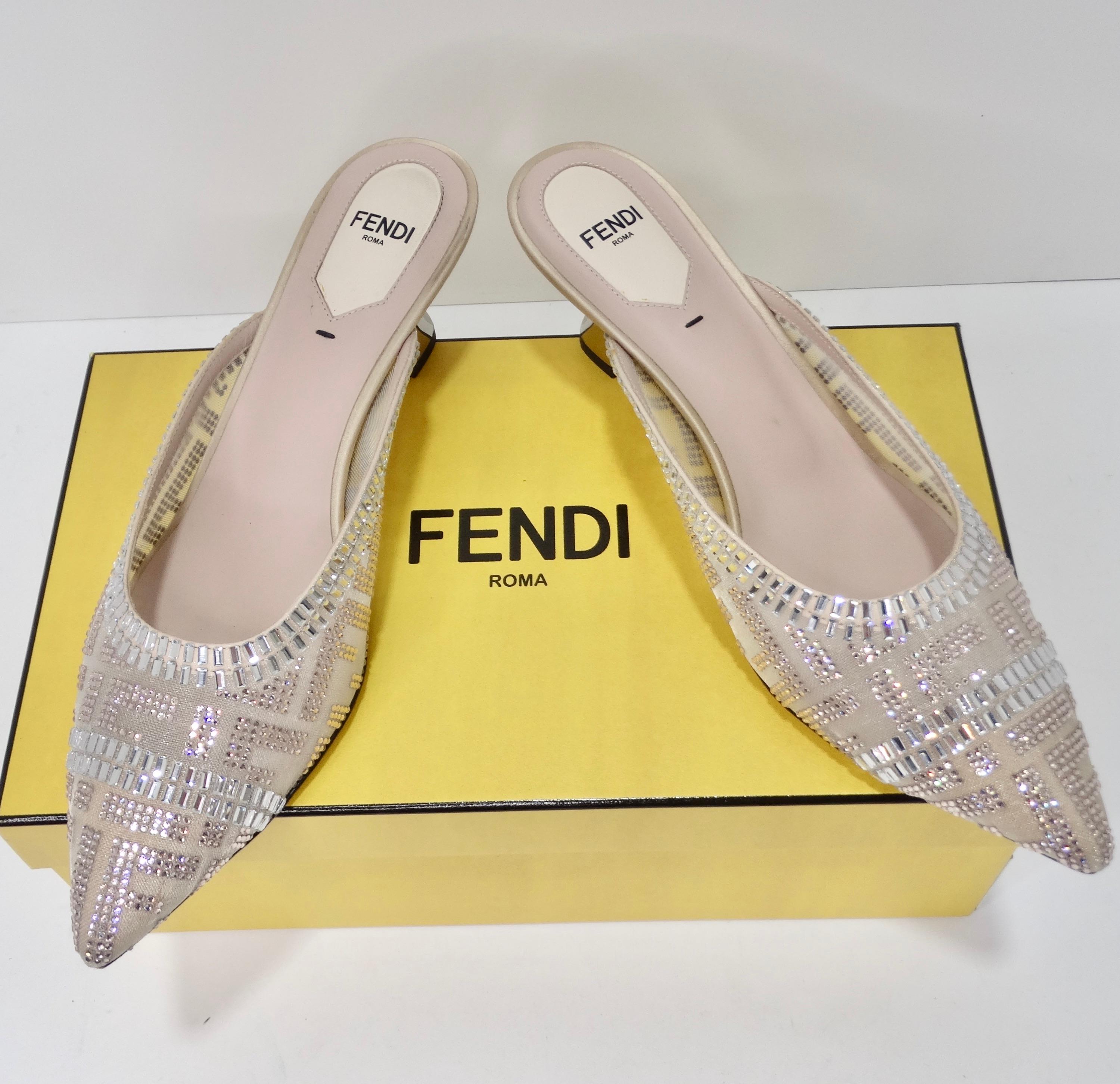 
Introducing the Fendi Pink Mesh Crystal Embellished Colibrì Pointed Toe Mules - a mesmerizing blend of glamour, artistry, and modern elegance. These heels are more than just footwear; they're a work of art that brings a touch of luxury and