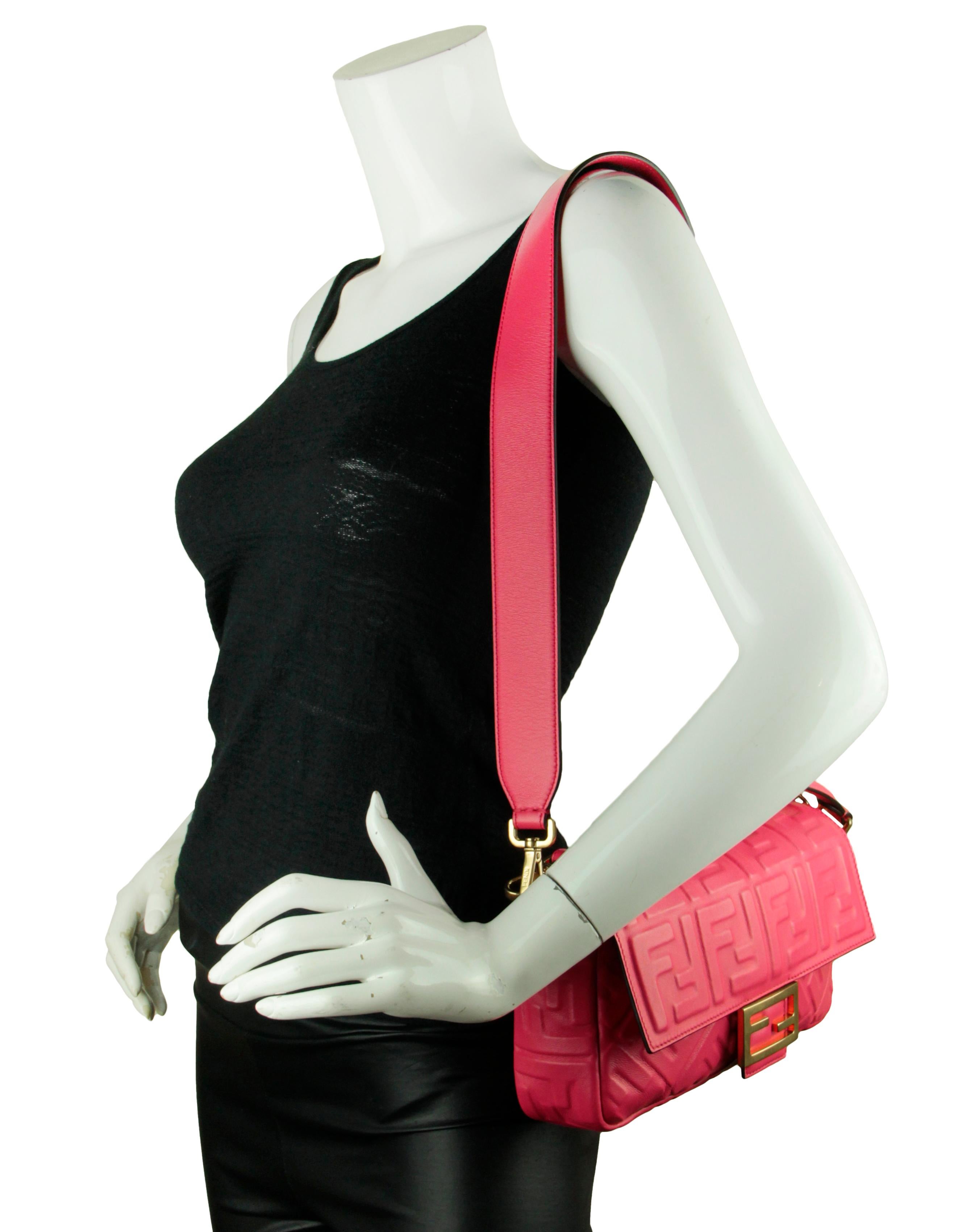 Fendi Pink Nappa Embossed Logo FF 1974 Large Baguette NM Bag w/ Two Straps
Made In: Italy
Year of Production: 2022
Color: Lampone pink
Hardware: Goldtone
Materials: Nappa leather
Lining: Textile
Closure/Opening: Flap top with magnetic