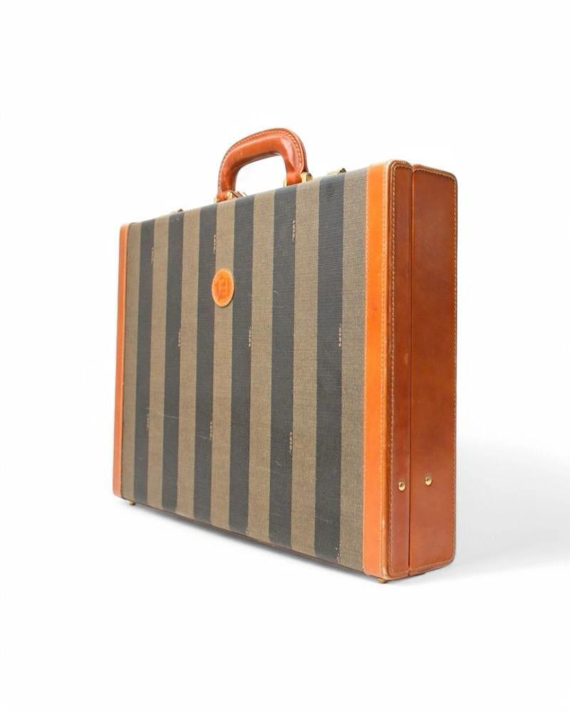 Fendi signature briefcase, rigid model, made of striped canvas and brown leather trim with gold hardware. Featuring an interlocking closure, internally lined in beige suede fabric with several slots and pockets for documents, it is very roomy.