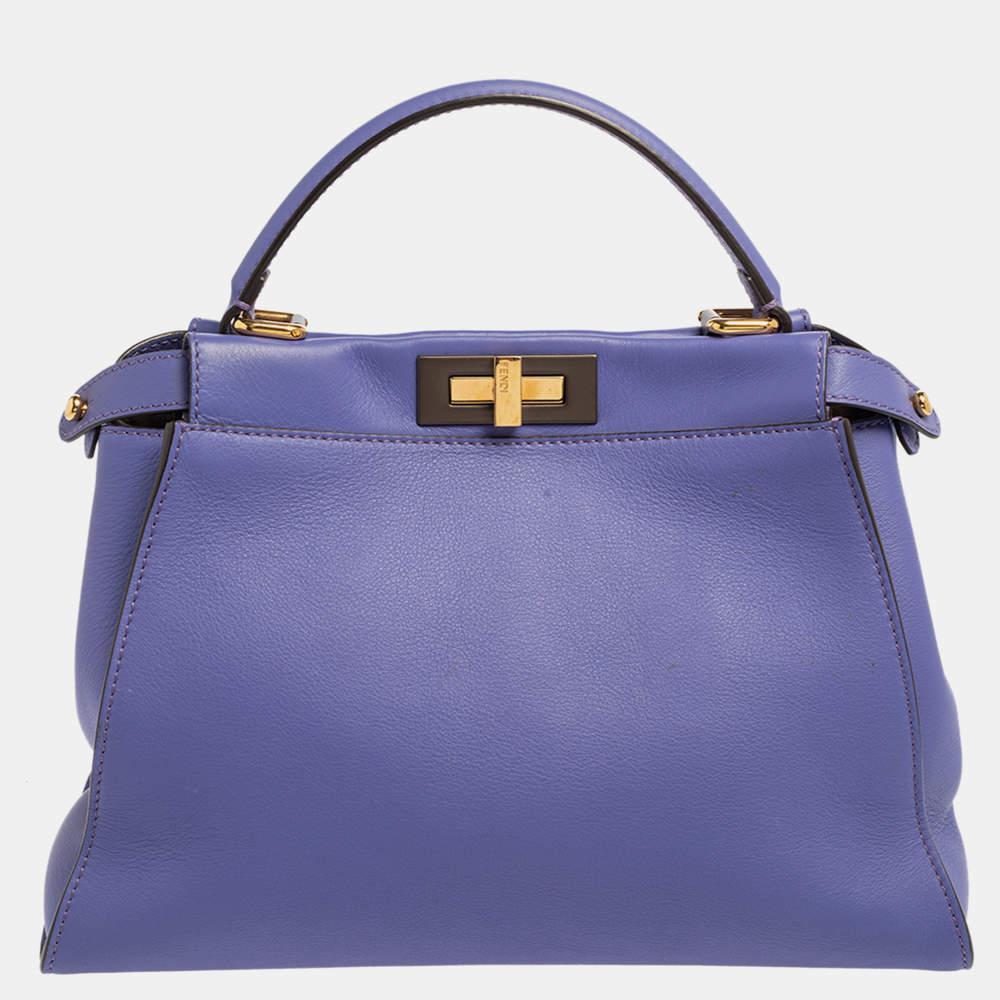 This exquisite Peekaboo from Fendi is highly coveted, and since its birth in 2009, it has swayed us with its shape, design, and beauty. This version comes meticulously crafted from leather and designed with a top handle for you to swing it. A