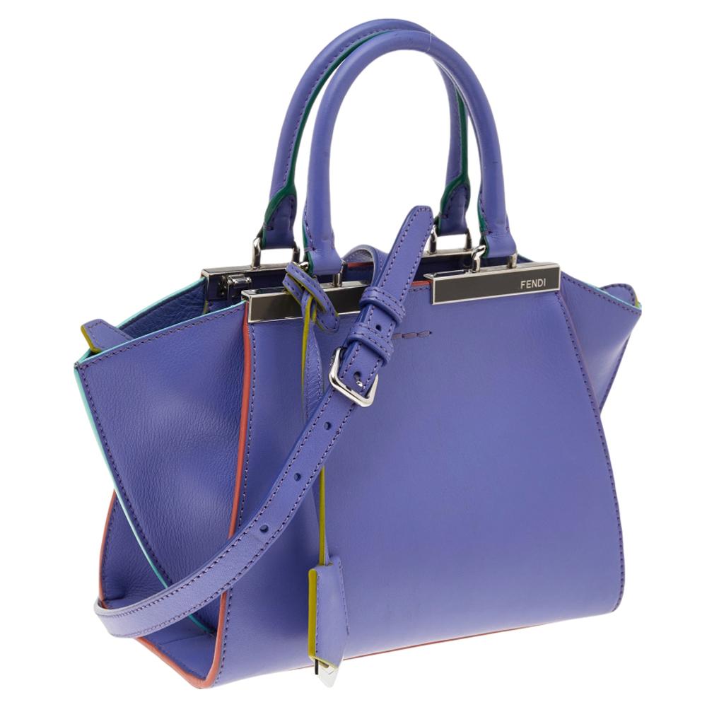 Fendi brings you this stunning update of their famous 2jours bag, the 3Jours! Crafted from leather, the purple bag has two handles and a gorgeous silver-tone bar on top that is split down the middle. The insides are leather-lined and spacious enough