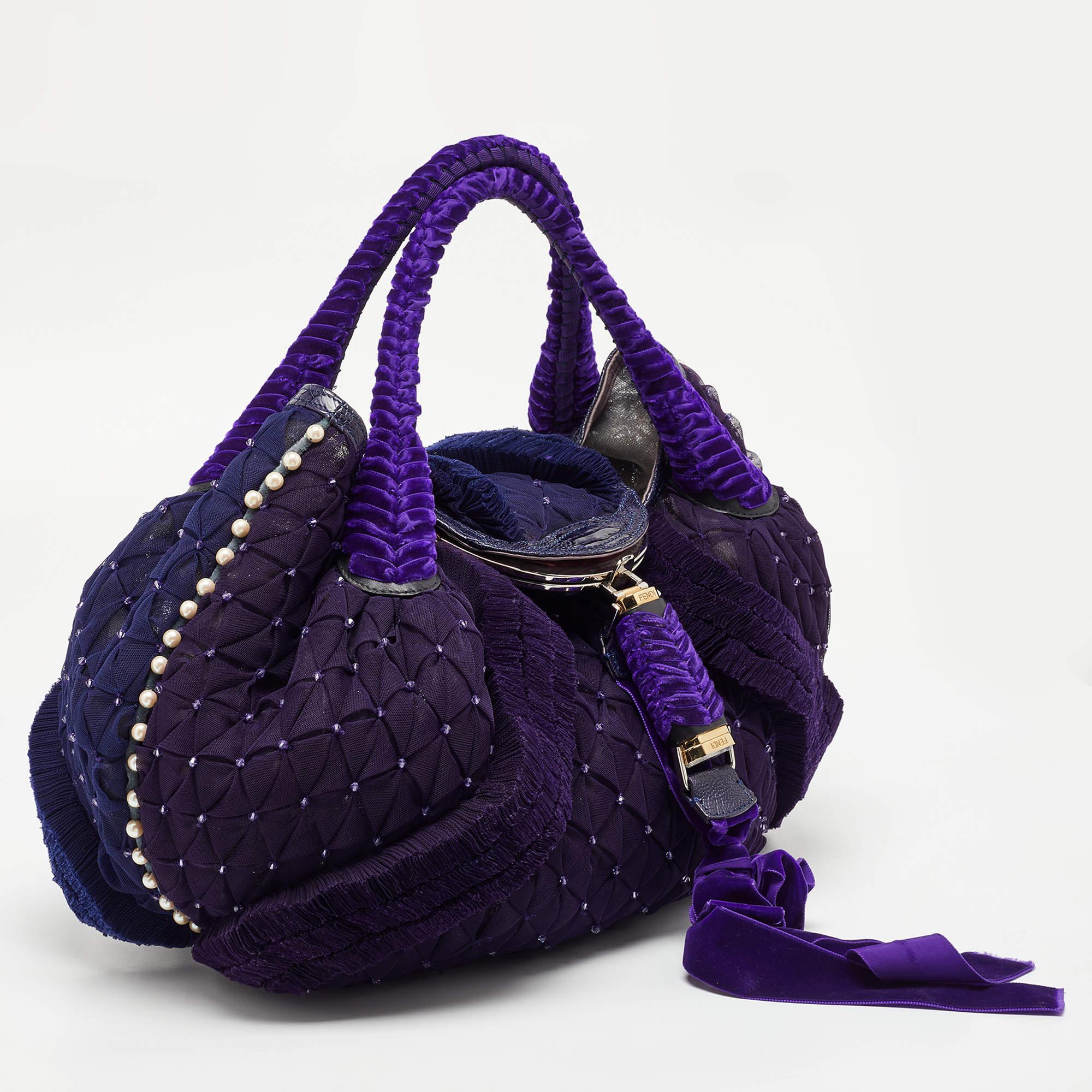 With a Fendi bag by your side, it's going to be a stylish OOTD no matter the day. Here, we have this embellished Spy hobo bag just for you. Its compact shape, stunning details, and luxe elegance make it a worthy purchase.

