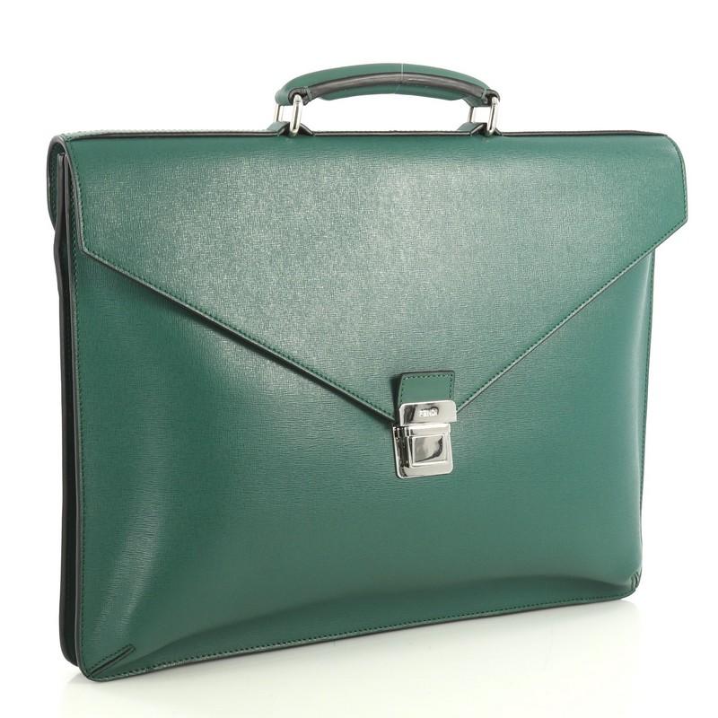 This Fendi Pushlock Briefcase Leather Large, crafted from green leather, features leather top handle and silver-tone hardware. Its push-lock closure opens to a black fabric interior with two open compartments, middle zip compartment and side zip