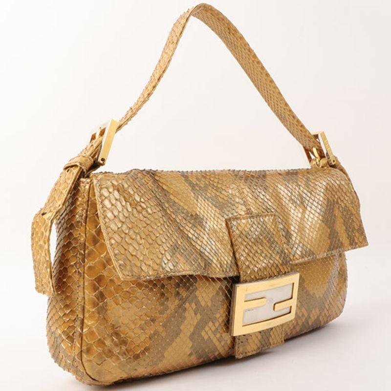 Fendi Python Mama Baguette Gold

Additional information:
Interior pocket x1
Accessories: Dust bag
Made in Italy TIMELESS PIECES.
Size: 26 W x 4 D x 14 H cm
Shoulder drop: 37- 49cm ( 3 adjustment holes).
Condition: Good
Front: With slight out of