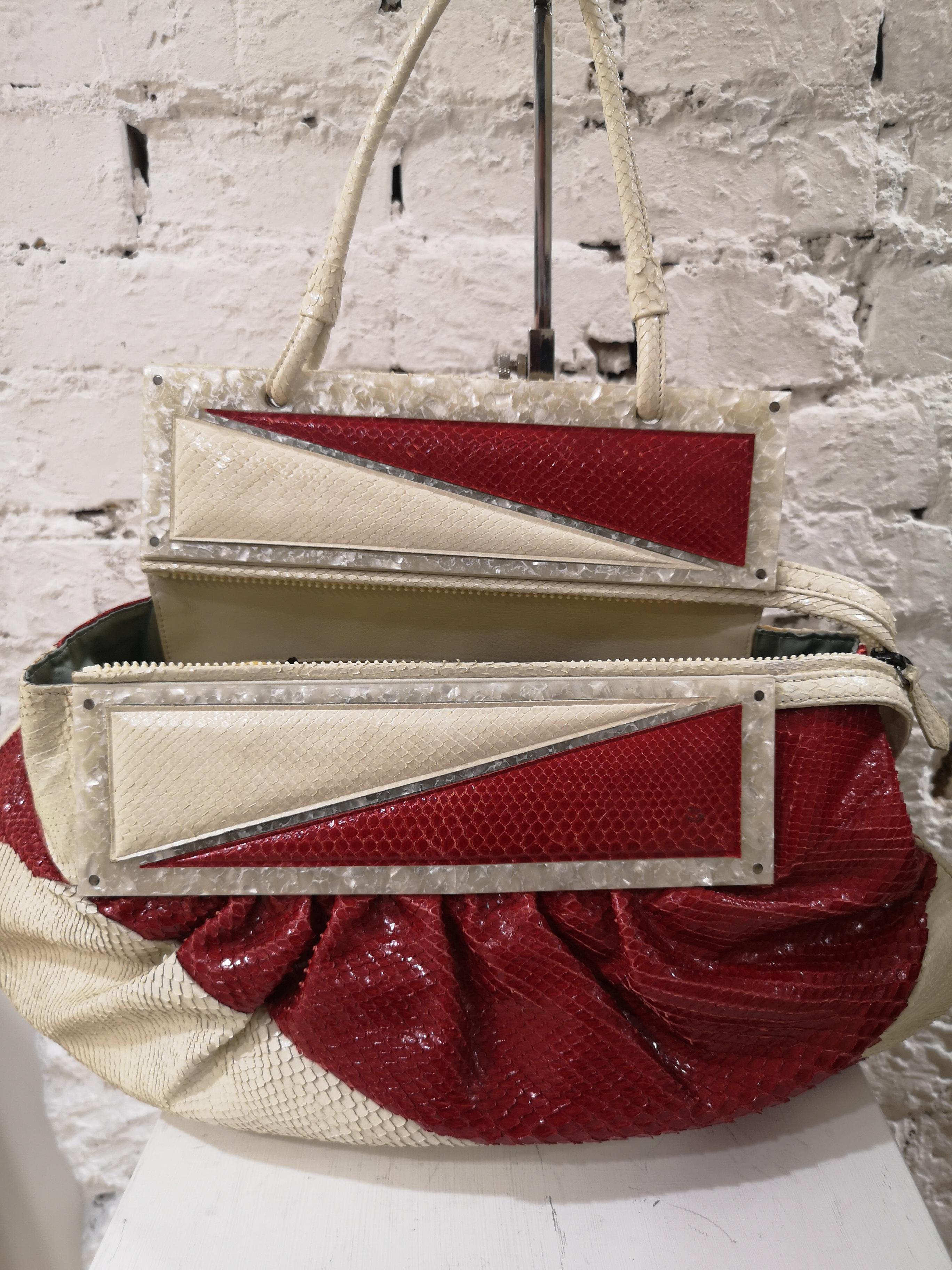 White Fendi python skin cream and red shoulder bag