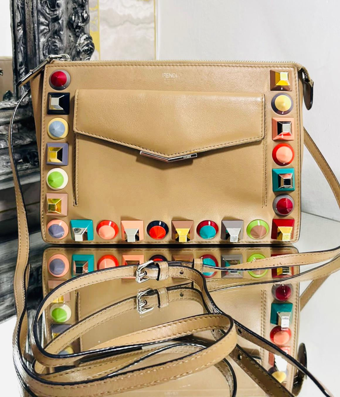 Fendi Rainbow Stud Leather Bag

Nude shoulder bag designed with multicoloured, oversized studs along the edges.

Featuring small, flap compartment to the front and zipped top.

Detailed with silver hardware with 'Fendi' engravement to the centre and