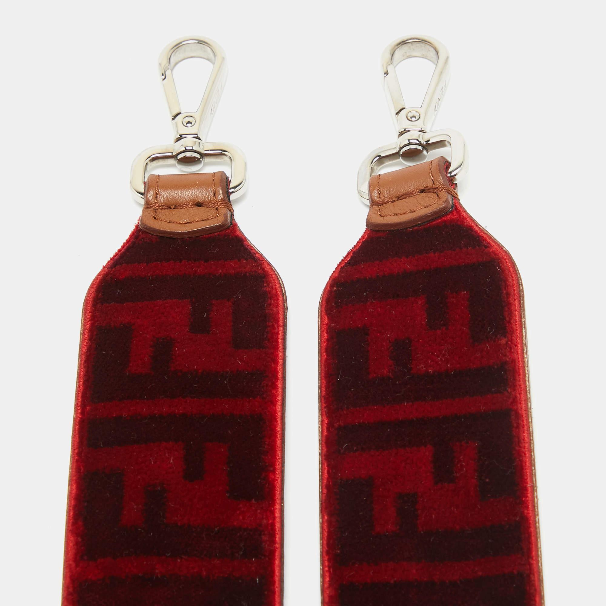 Made in Italy this Fendi shoulder strap is made from velvet. The strap can be attached to any bag using the two silver tone clasps.