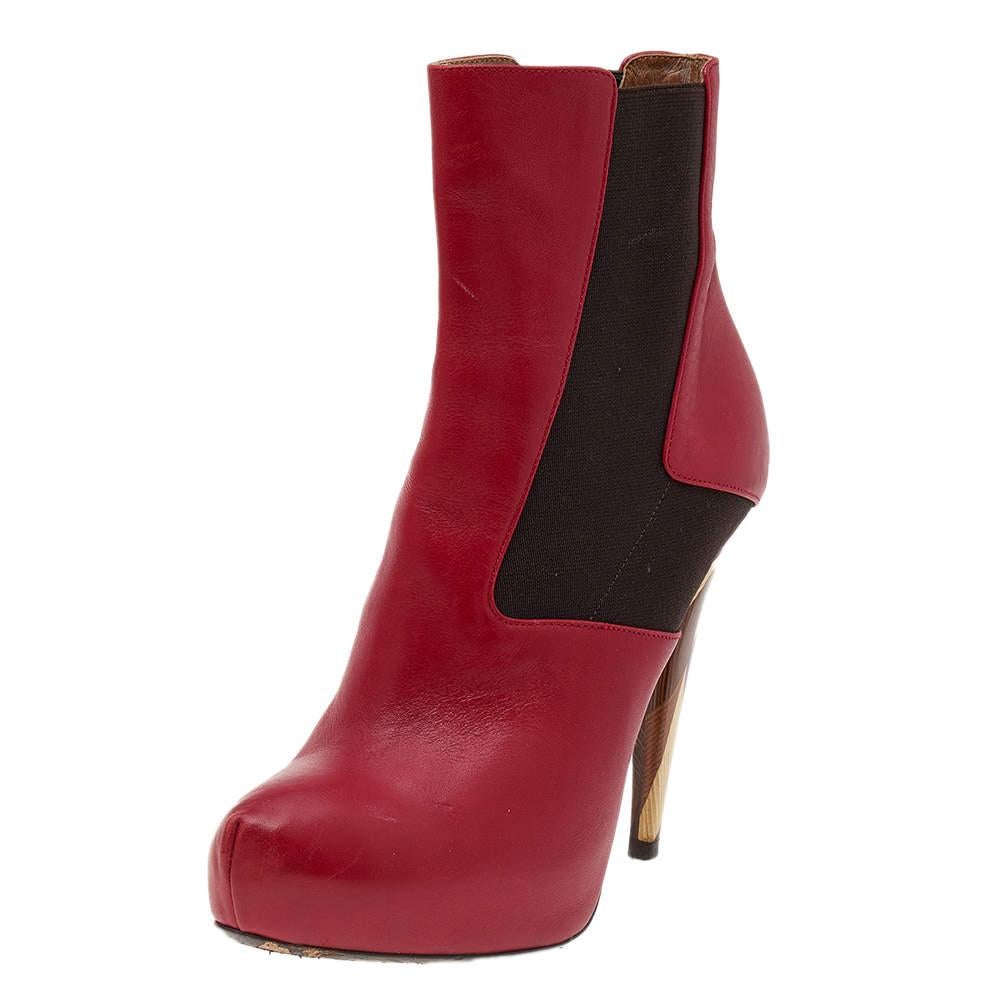 Fendi brings to your closet these uber-chic ankle boots that are meticulously crafted from leather and stretch fabric. Featuring quirky high heels, this pair has rounded toes, platforms, and a stylish silhouette. Wear them with a dress or a coat and