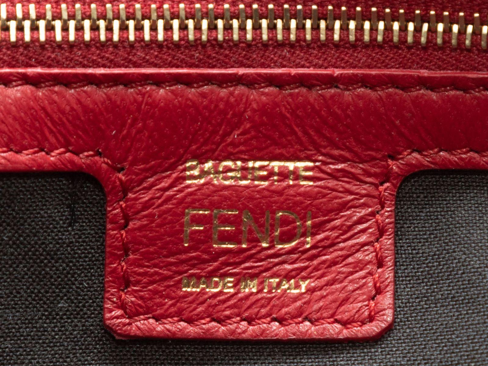 Product Details: Red Fendi Embossed Leather Zucca NM Baguette Bag. This Zucca NM Baguette Bag features an embossed leather body, gold-tone hardware, a single flat shoulder strap, and a front logo flap closure. 14