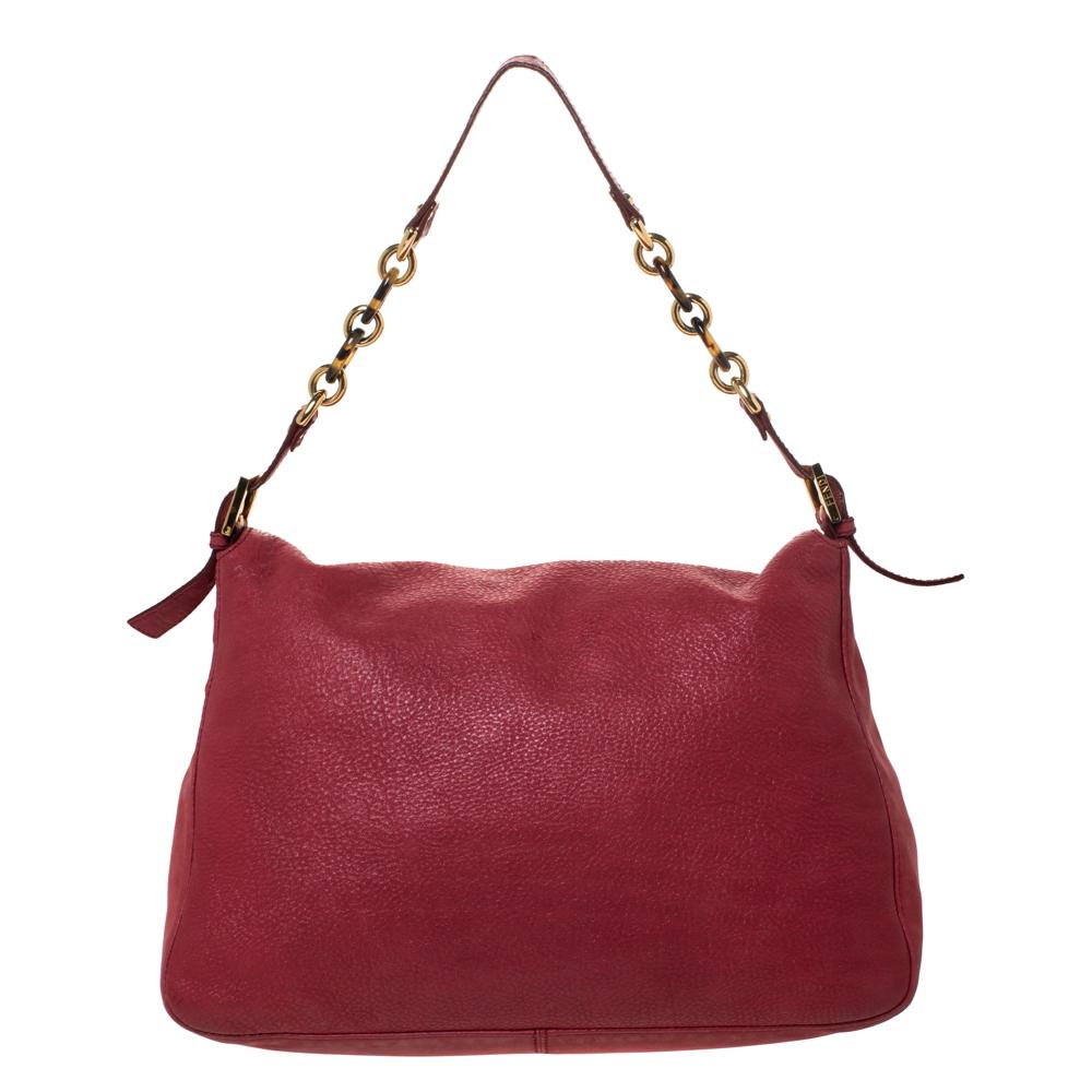 The Mama Forever shoulder bag from Fendi is a classic fashion choice. Detailed with their logo lock on the flap, this leather piece is simple and stylish. A well-sized satin interior and a leather handle complete the bag.

Includes: Original