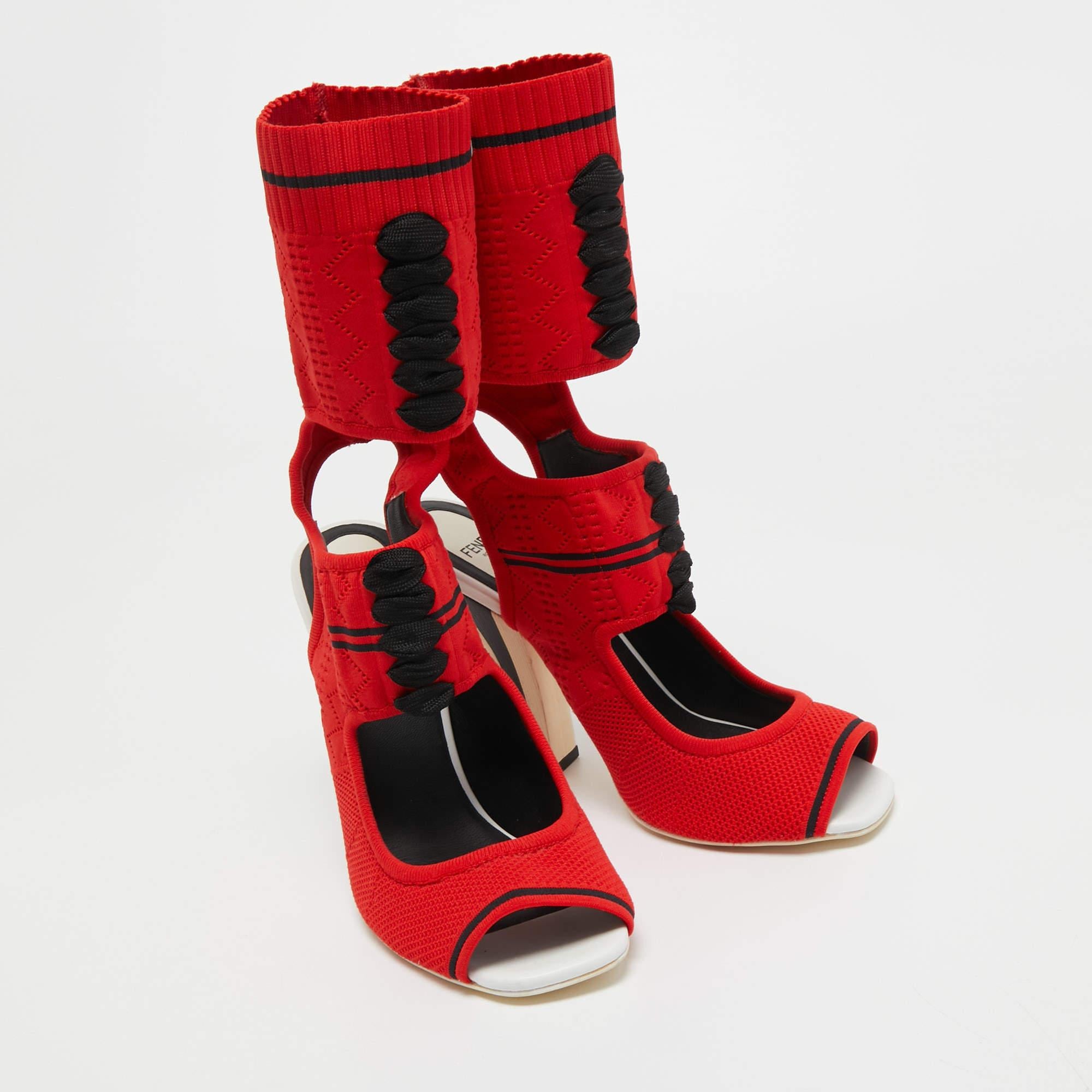Crafted in Italy, Fendi's sandals are stylish, edgy, and sporty. They are knit fabric in a sock-like silhouette adorned with laces, open toes, and a snug fit. These boots are elevated on striped 11.5 cm heels. Style them with a short dress for a