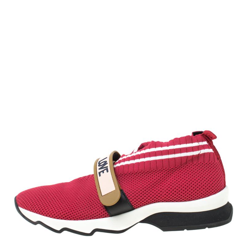 Enjoy footwear ease with this pair of Rockoko sneakers by Fendi. They've been crafted from knit fabric and designed with red and white trims along with FENDI-LOVE detailed velcro straps on the uppers. Equipped with comfortable fabric-lined insoles