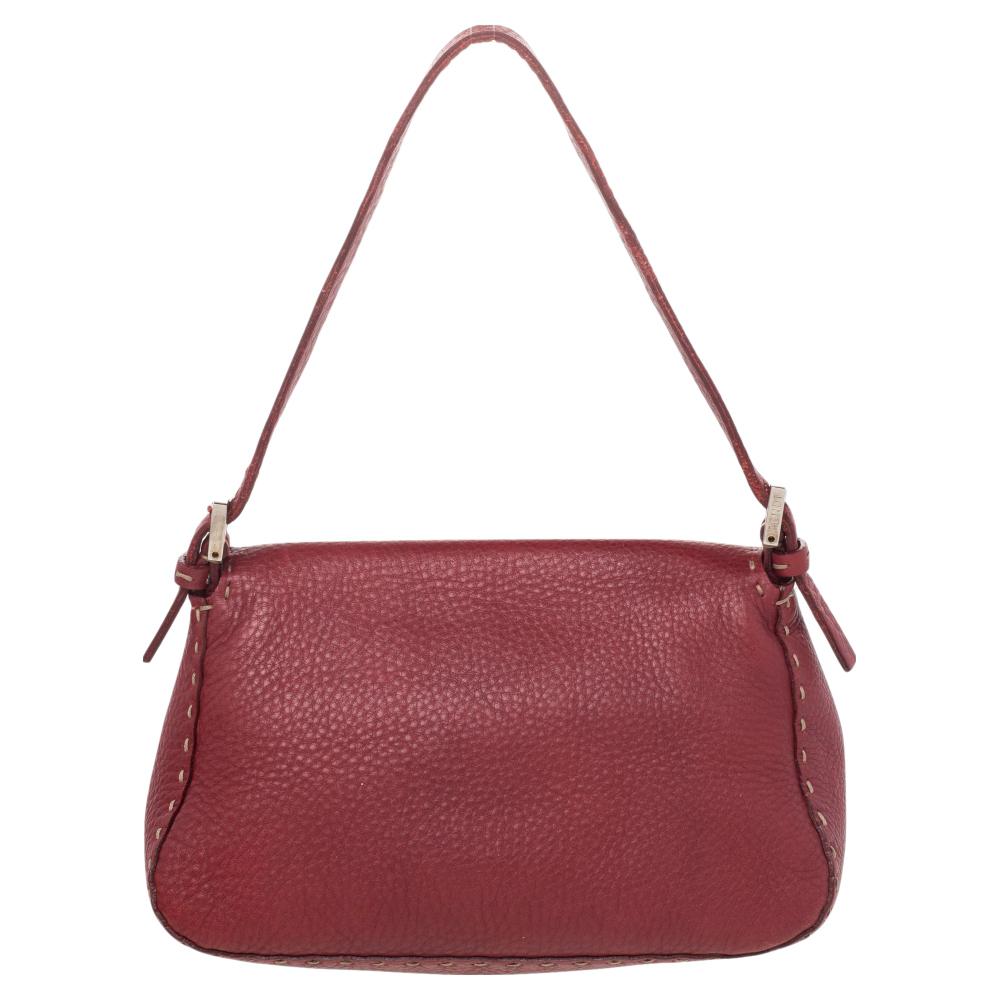 The Baguette was created by Silvia Venturi Fendi in 1997 and has been admired since then. This bag is the epitome of eternal style and luxury and is desired by every fashion connoisseur. The external structure is made from red leather and flaunts
