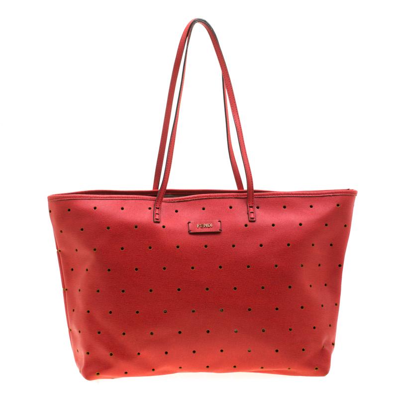 Fendi's Roll bag is simply breathtaking. Crafted from perforated red leather, this tote is striking and stylish all in one! It features comfortable double top handles and a Fendi plaque in gold-tone hardware on its front. Its interior is lined with