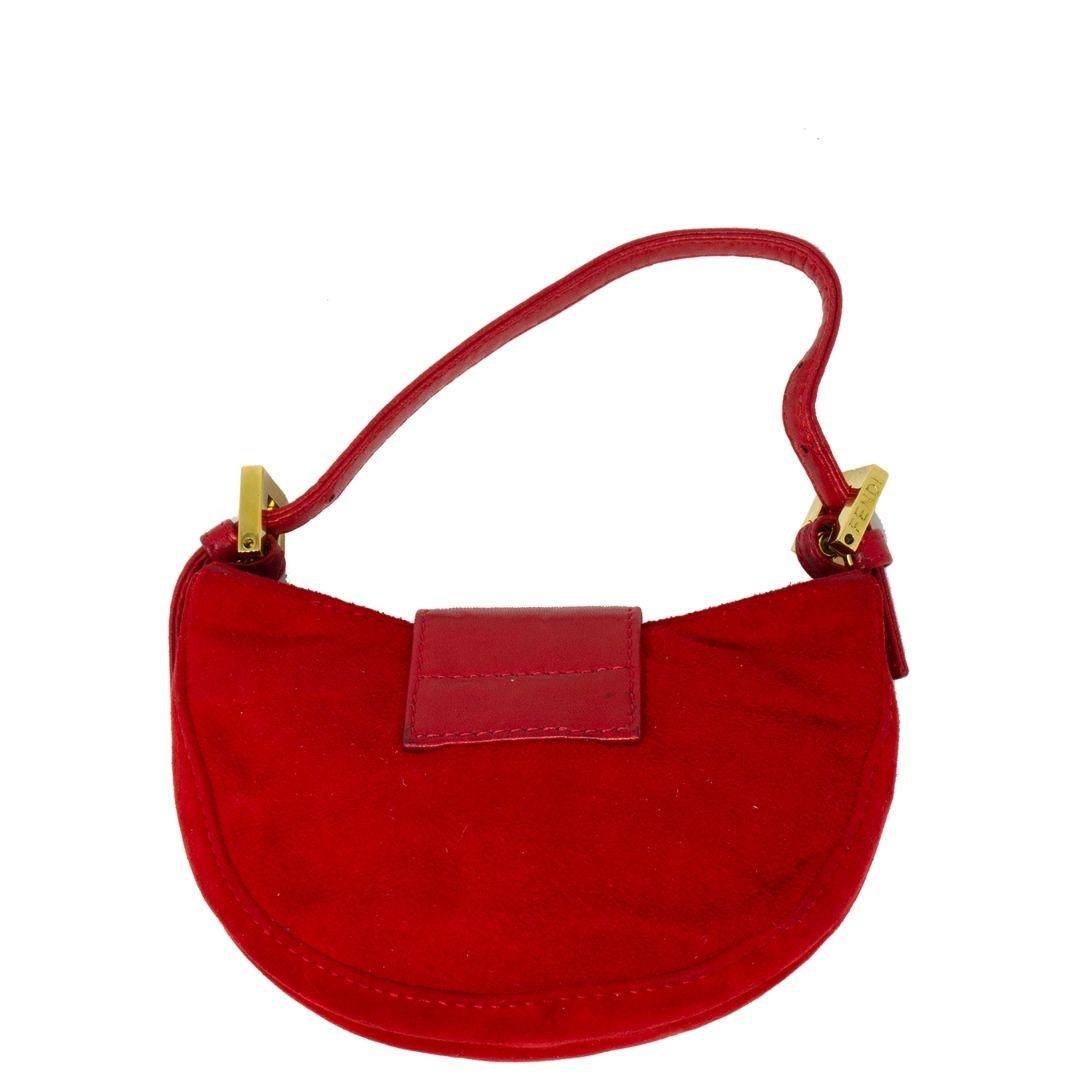 A sister to the iconic Fendi Baguette bag, the croissant-bag offers a stylish flare to the traditional style. We love this one because of the statement silhouette, fun color and stunning suede material. Also seen on Kim K, this beauty is crafted in