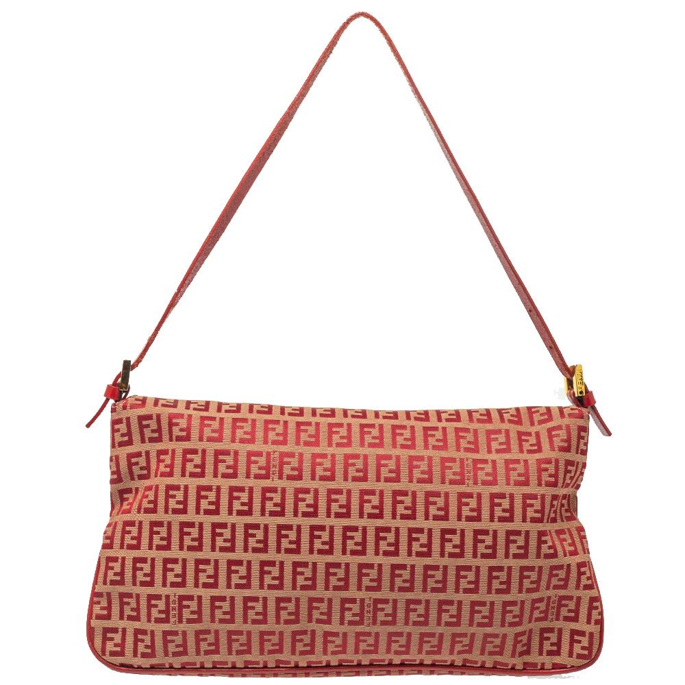 This stunning shoulder bag by Fendi is great to style for day or night parties. Crafted in Zucchino canvas & leather, this striking red-hued shoulder bag features a leather strap. With a front flap closure, it features a chunky FF logo plate for a