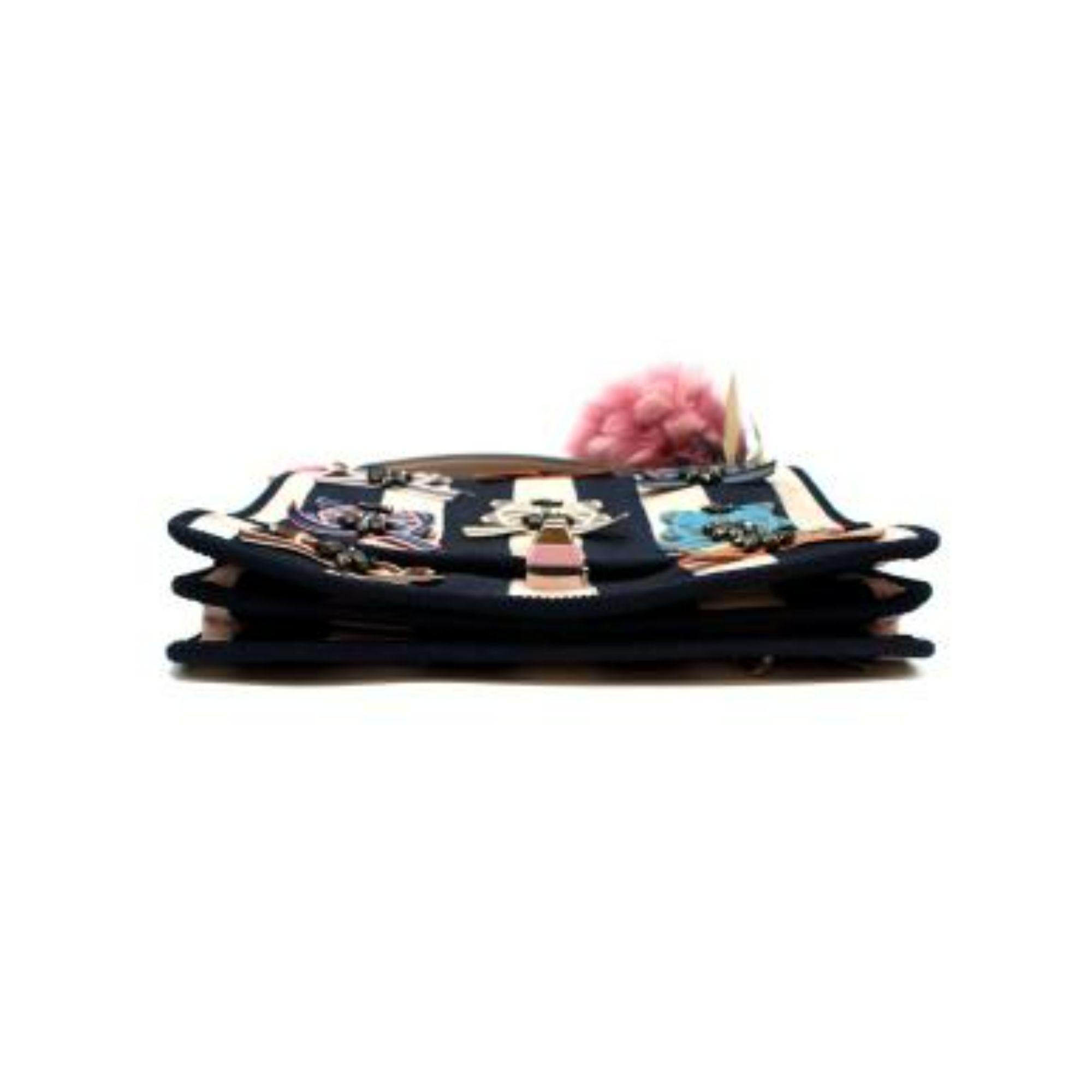 Fendi Bow detail stripe bag

- Two asymmetric colorful pattern handles
- Bow detailing throughout
- Striped body canvas
- Pink fur ball attached detail
- Clasp fastening
- Two interior compartments
- One interior slip pocket
- Crystal-embellished