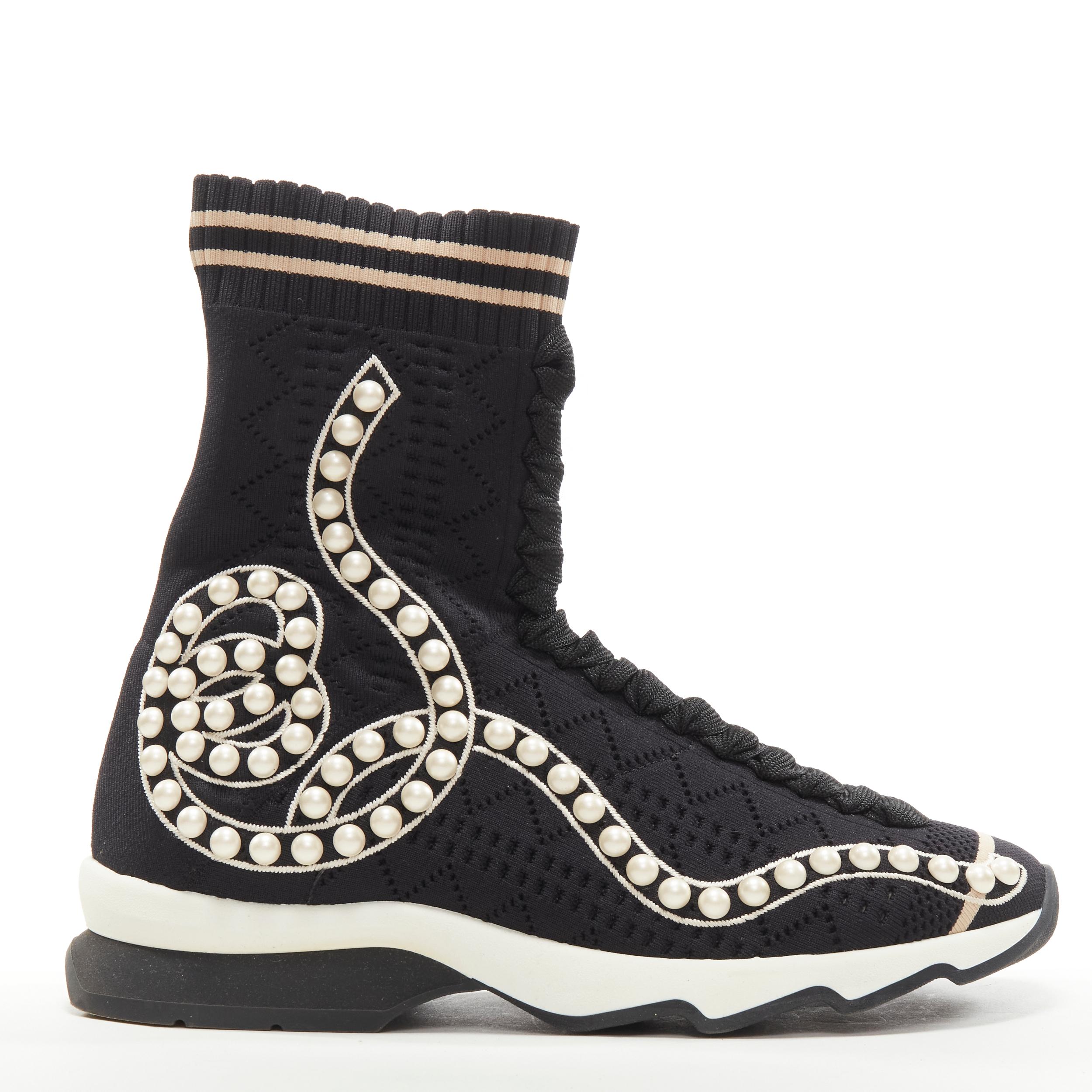 FENDI Rockoko black pearl embellished black sock knit high top sneaker EU36 
Reference: ANWU/A00371 
Brand: Fendi 
Model: Rockoko 
Material: Fabric 
Color: Black 
Pattern: Solid 
Extra Detail: Stretch fit. Perforated sock knit with faux pearl