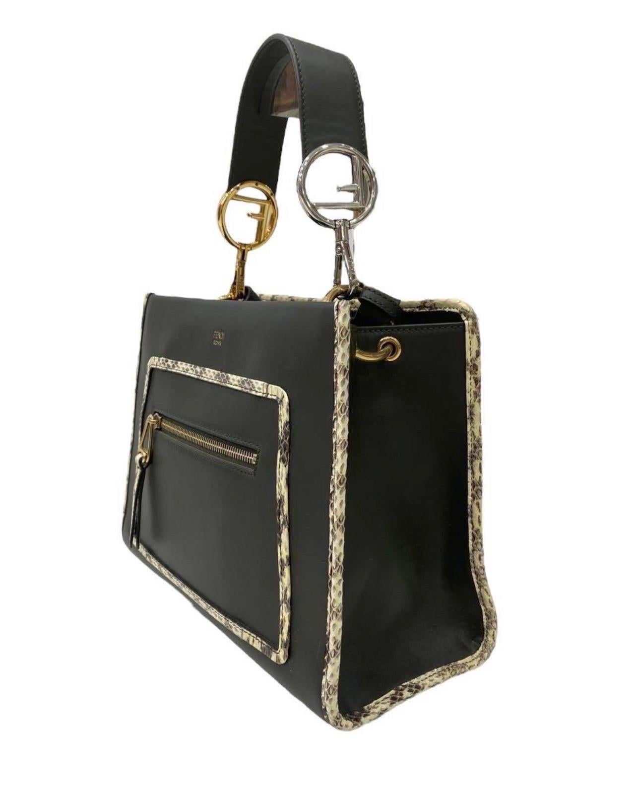 Bag by Fendi, Runway model, made of military green smooth leather and golden hardware. Equipped with a central magnetic hook closure, internally lined in mud-colored suede, quite roomy. Equipped with a removable central handle and an equally