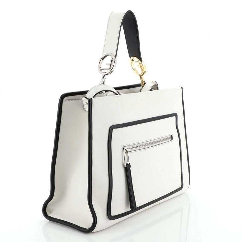 This Fendi Runaway Handbag Leather Regular, crafted from white leather, features a flat leather handle, exterior zip pocket, and silver-tone hardware. Its magnetic snap button closure opens to a neutral microfiber interior with zip and slip pockets.