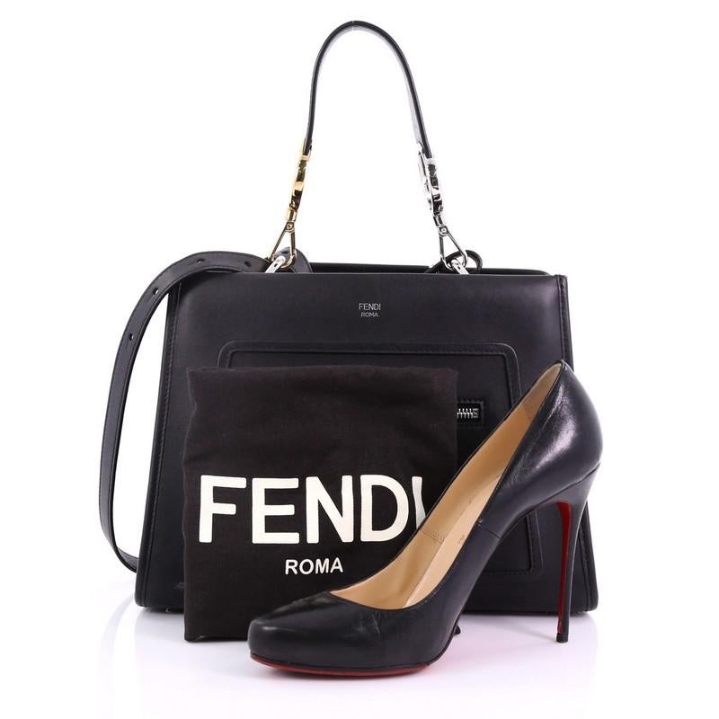 This Fendi Runaway Handbag Leather Small, crafted from black leather, features a flat leather handle, exterior zip pocket, and silver and gold-tone hardware. Its magnetic snap button closure opens to a gray microfiber interior with zip and slip