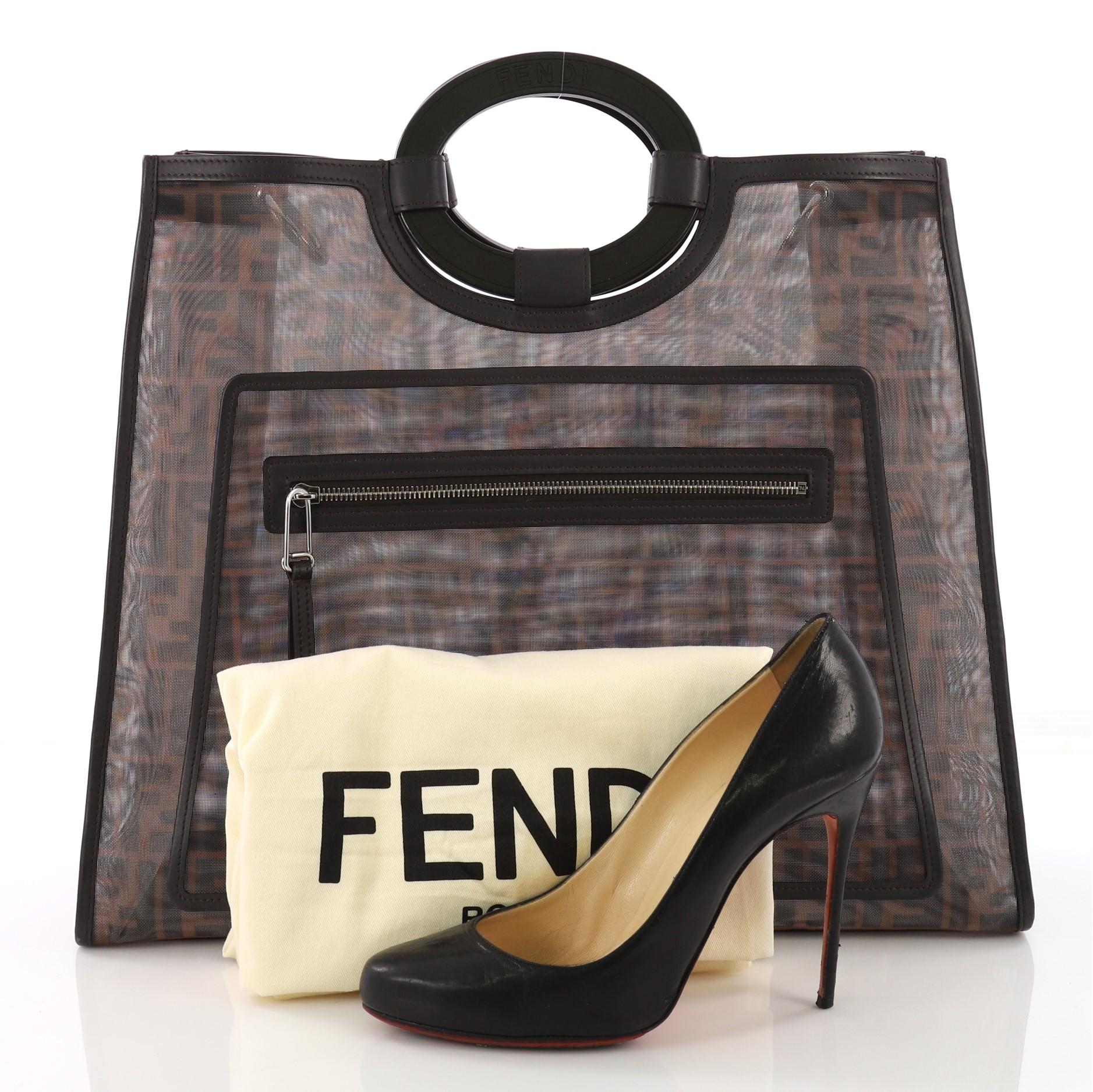 This Fendi Runaway Tote Zucca Mesh Large, crafted from brown and black mesh, features round top handles, all over logo print, front zip pocket, and silver-tone hardware. It opens to a mesh interior with zip and slip pockets. **Note: Shoe