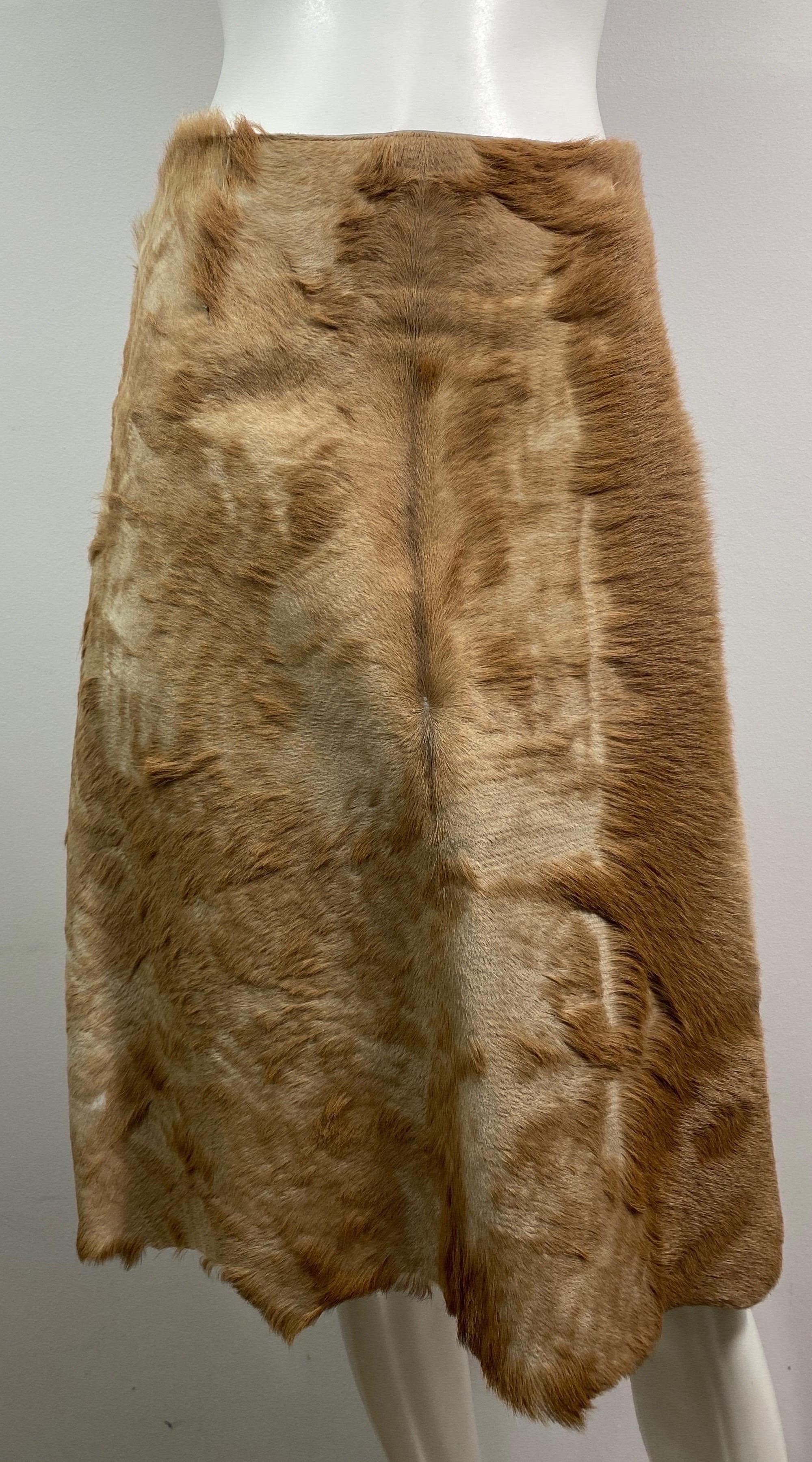 Fendi Runway Fall 1999 Pony Hair Leather Skirt -Size 42. This Karl Lagerfeld designed runway piece was look 70 in the Fendi Fall 1999 runway show in Milan. The Skirt is a tan pony haired leather with an uneven scalloped like hemline, silk lined, A