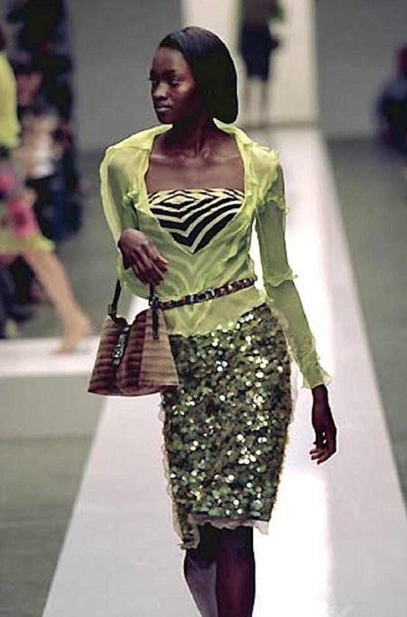 Dating to the S/S 2000 collection designed by Karl Lagerfeld, this stunning Fendi skirt is designed to sit low on the hips and features the iconic Zucca print completely encrusted with acid green pailettes and edged with delicate sheer silk chiffon