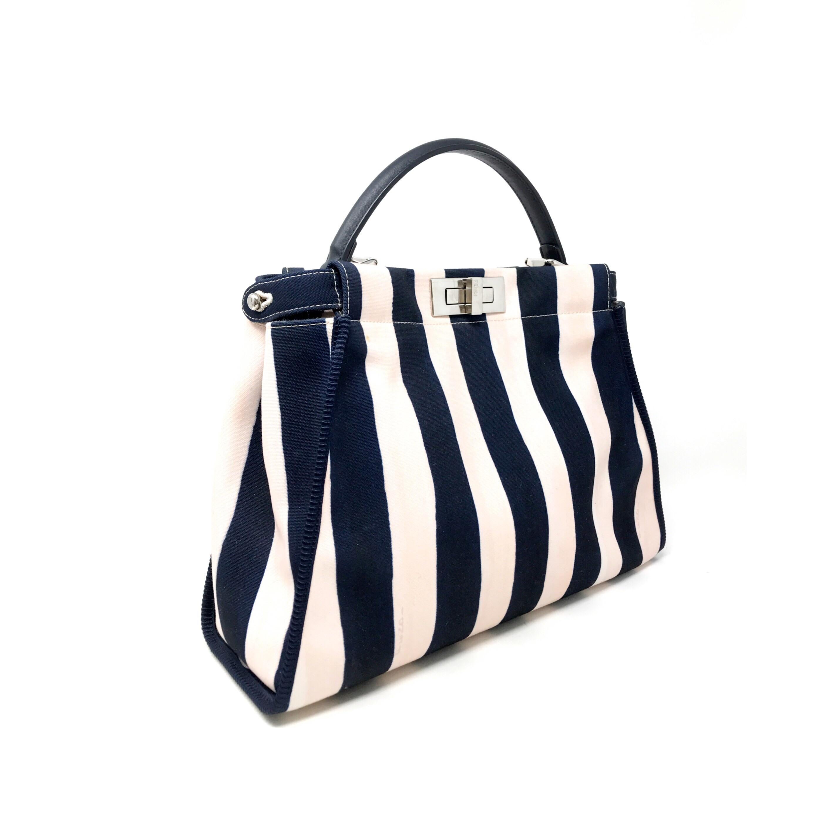 Fendi Peekaboo bag in striped 
fabric blue / beige / pink color 
Very good condition, medium size
Size 34x24 cm
Excellent condition complete with removable shoulder strap.