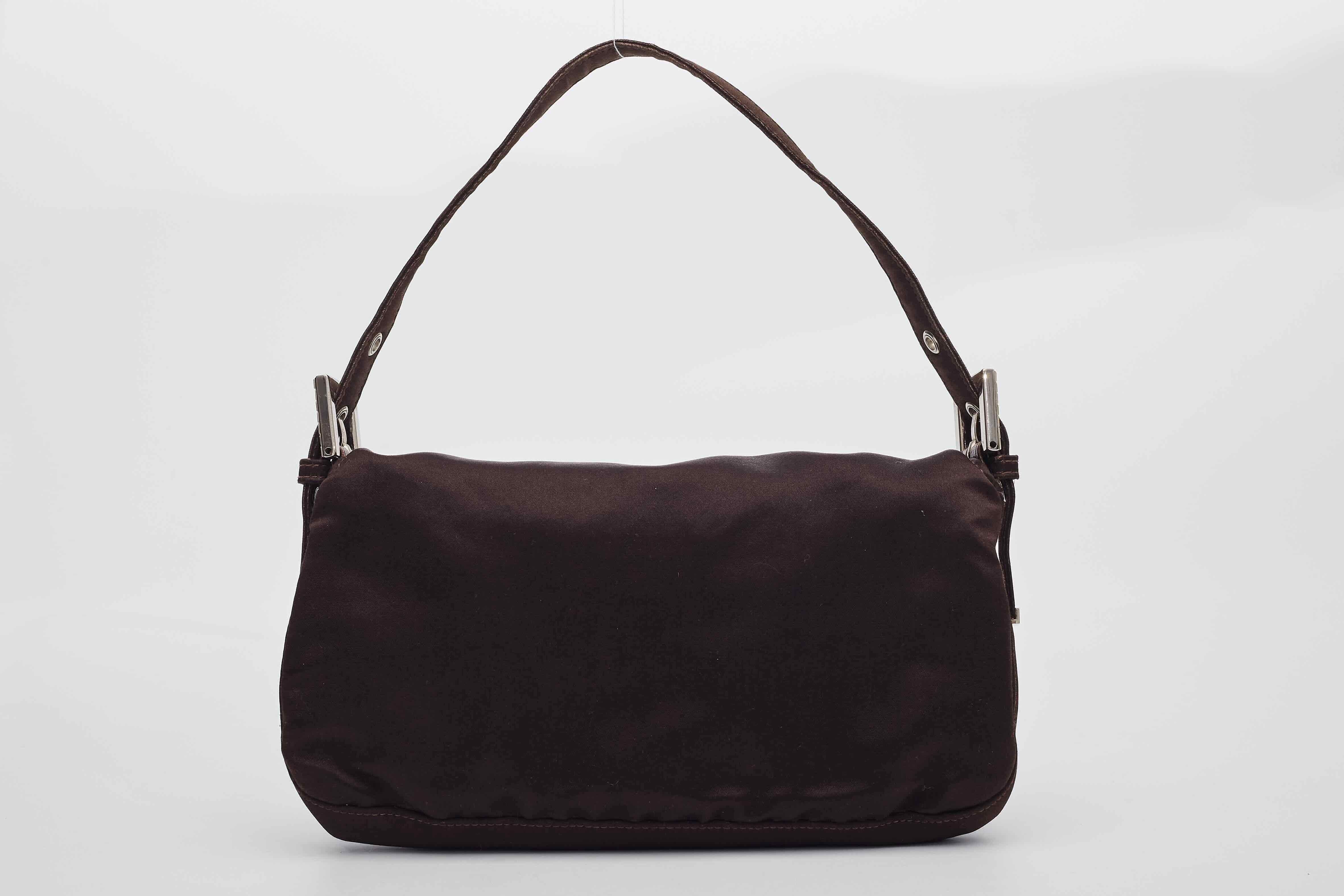 Color: Brown
Material: Satin with crystals
Item Code: Faint and rubbed off due to age.
Measures: Height 6” x Length 10” x Depth 2”
Drop: 7”
Condition: Good, Faint hairline scratches.

Made in Italy