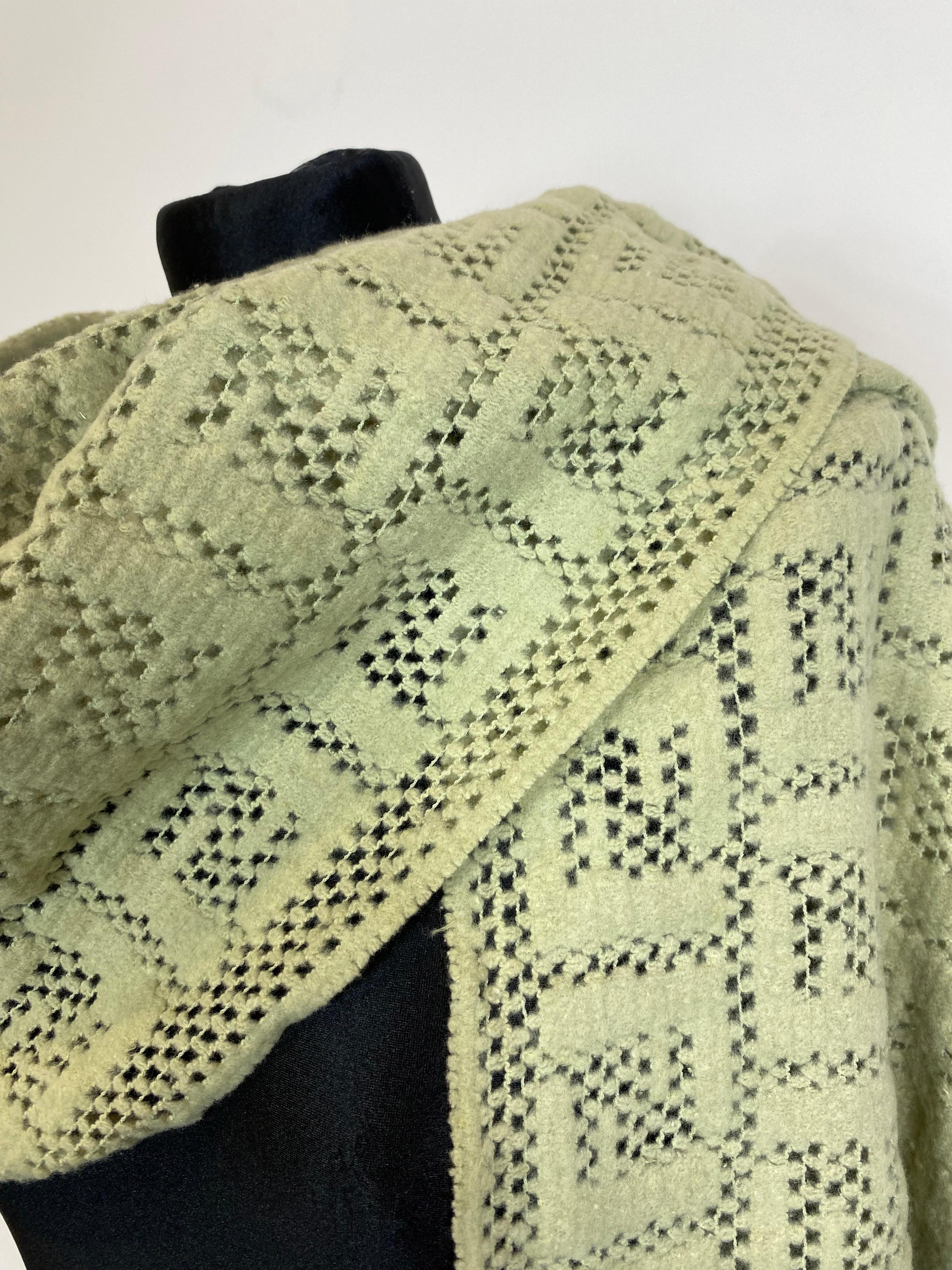Fendi perforated scarf with light mint green logo motif. 
Very soft. 
In very good condition, like new. 

Length 220 cm 
Height 54 cm 