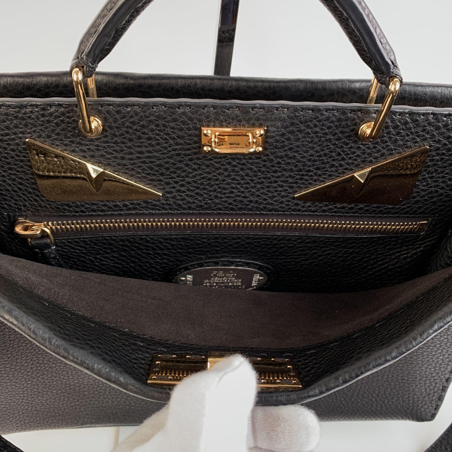 This beautiful Bag will come with a Certificate of Authenticity provided by Entrupy. The certificate will be provided at no further cost.

Beautiful Fendi Selleria 'Peekaboo Iconic Fit' briefcase bag in black pebbled leather. The bag features 2