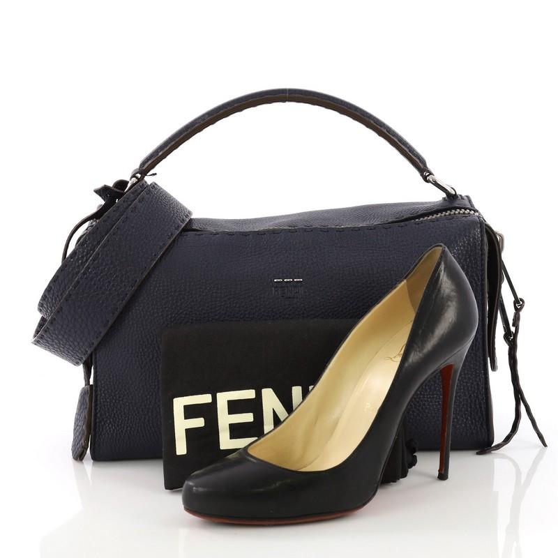 This Fendi Selleria Lei Bag Leather, crafted from blue leather, features looping leather handles and silver-tone hardware. Its zip closure opens to a blue suede interior with zip and slip pockets. **Note: Shoe photographed is used as a sizing