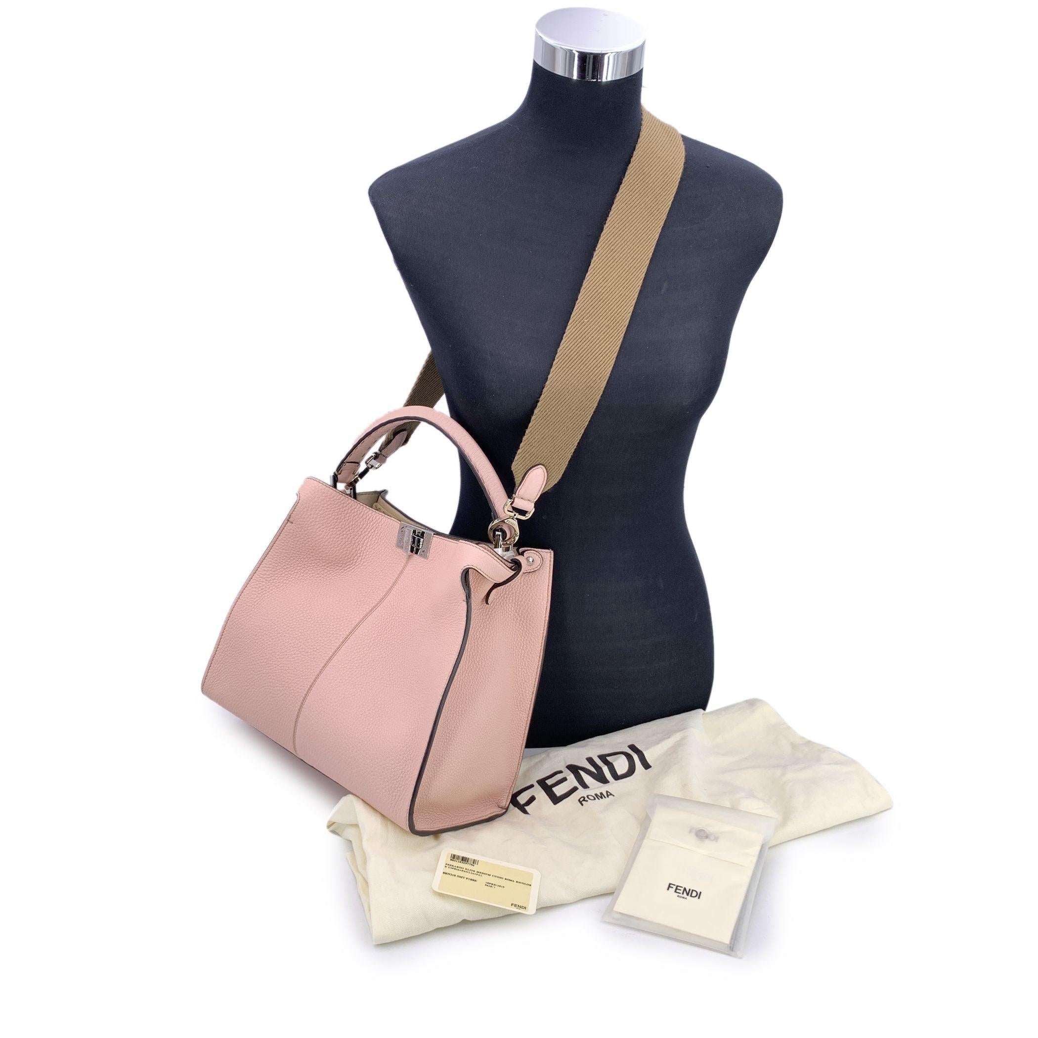 This beautiful Bag will come with a Certificate of Authenticity provided by Entrupy. The certificate will be provided at no further cost. This authentic Fendi Cuoio Romano Selleria Medium Peekaboo X-Lite is a true embodiment of elegance and