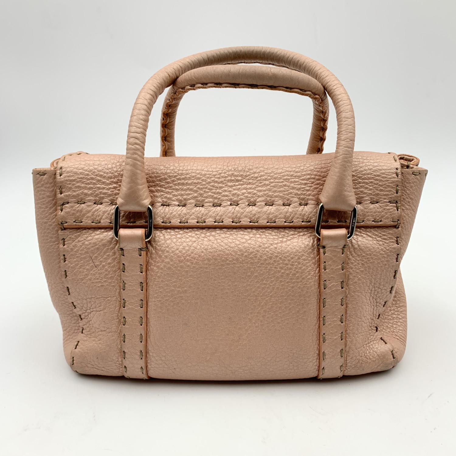 pink metallic handbag