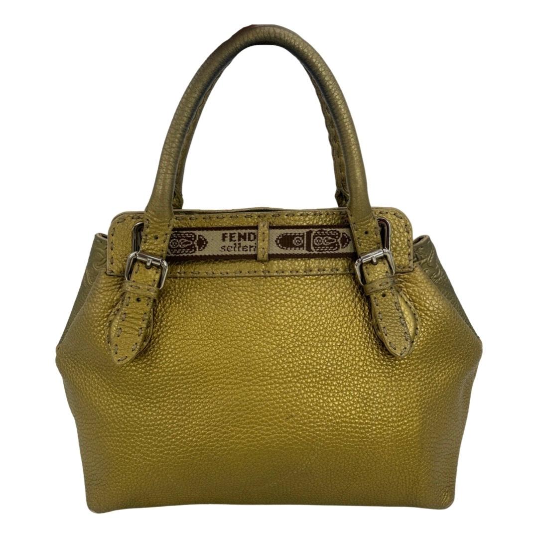 Fendi Selleria Villa Borghese Gold Leather Tote In good condition. Gold leather exterior with embossed horse design on front side and silver hardware trim. Gold Leather top handles with adjustable buckle ends. Top canvas and leather adjustable belt