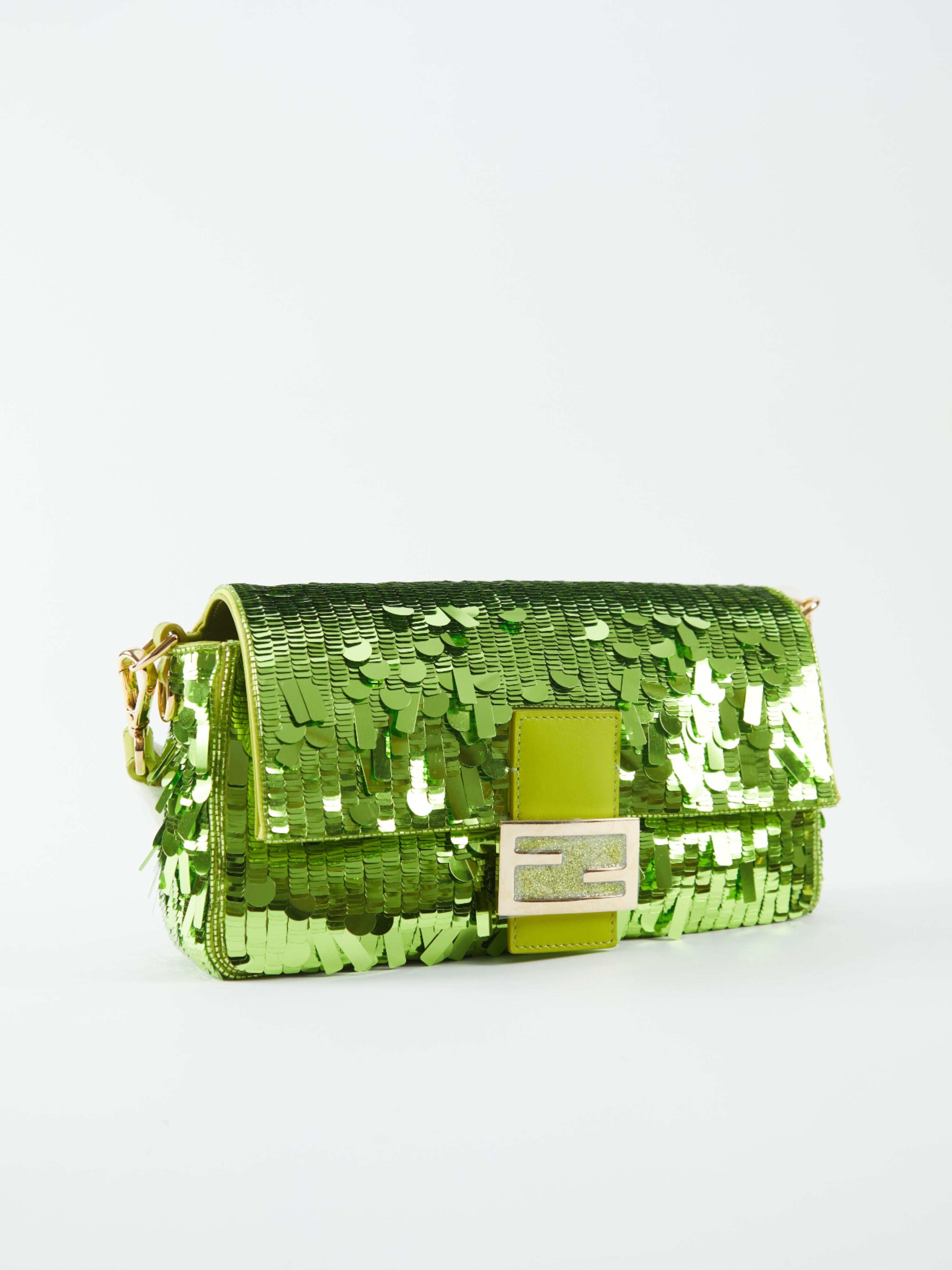 Fendi Sequin Baguette Bag in Green 

FF Clasp with magnetic closure, shoulder strap and detachable cross-body strap

Hand-embroidered with 12,600 square sequins and green calfskin 

Accompanied by: Fendi Box, Dust bag and COA Card

Measurements: H