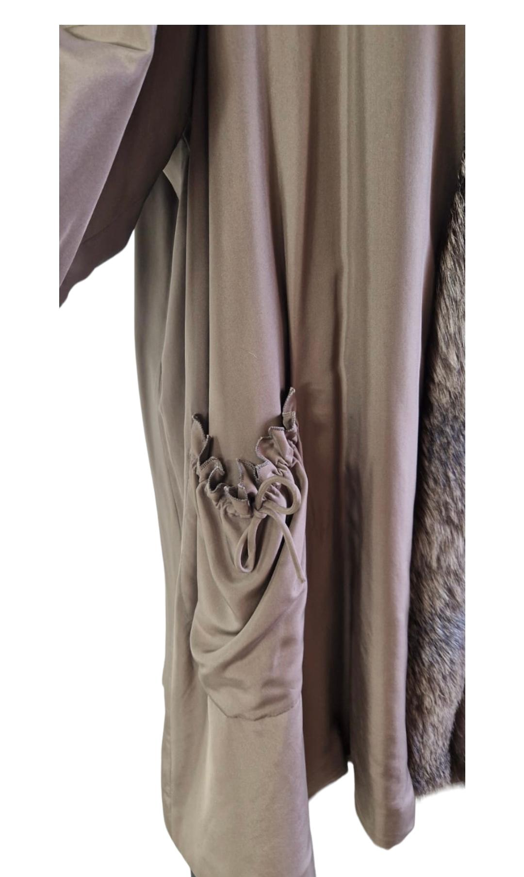 Gray Fendi silk coat with fur interior.