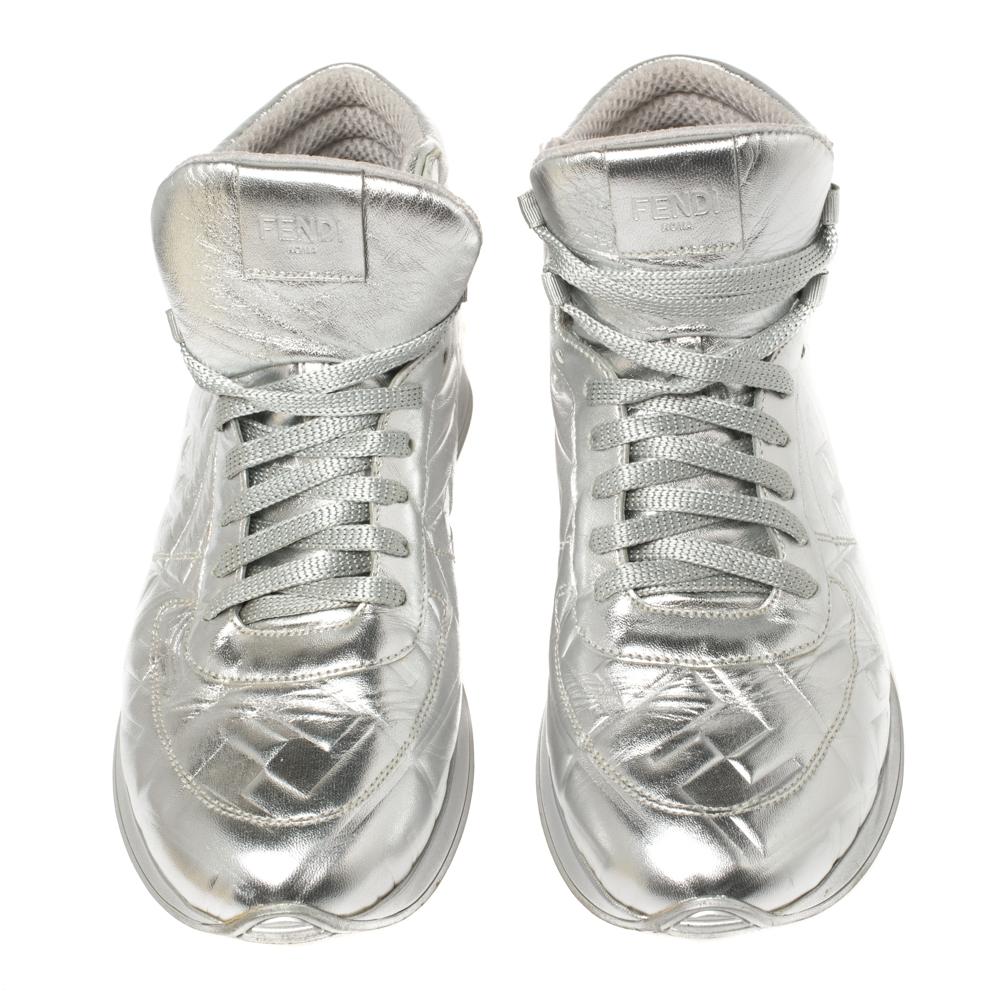 Decorated with FF motif embossing and lace-up front fastening, these silver leather high-top sneakers by Fendi will dazzle up your casual outfit. They're comfortable, durable, and fancy!

Includes: Original Dustbag

