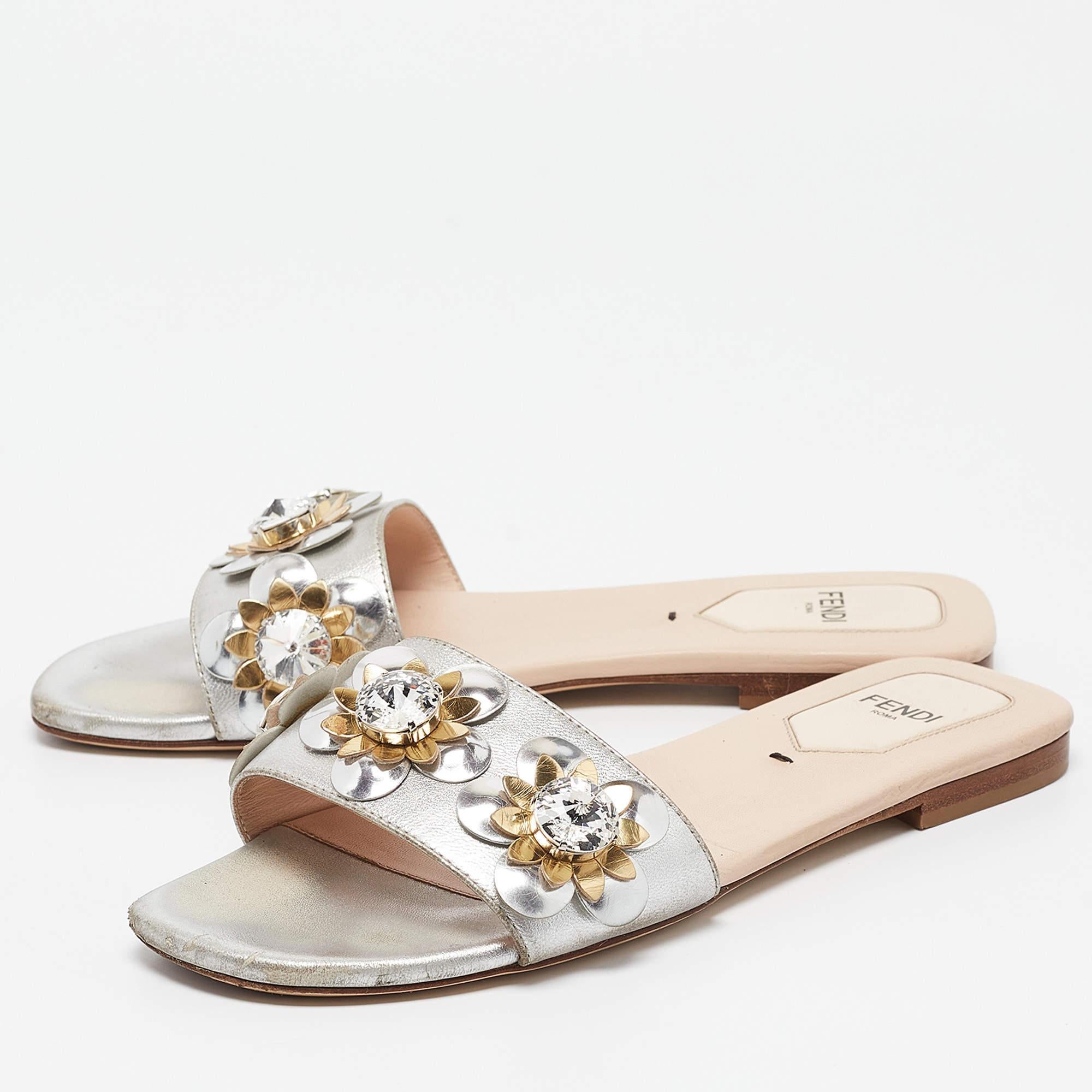 These slides from Fendi are chic and easy to slip on. Theyve been crafted from leather and detailed with flower motifs and studs on the uppers. This is one pair that speaks high fashion in a pretty way.