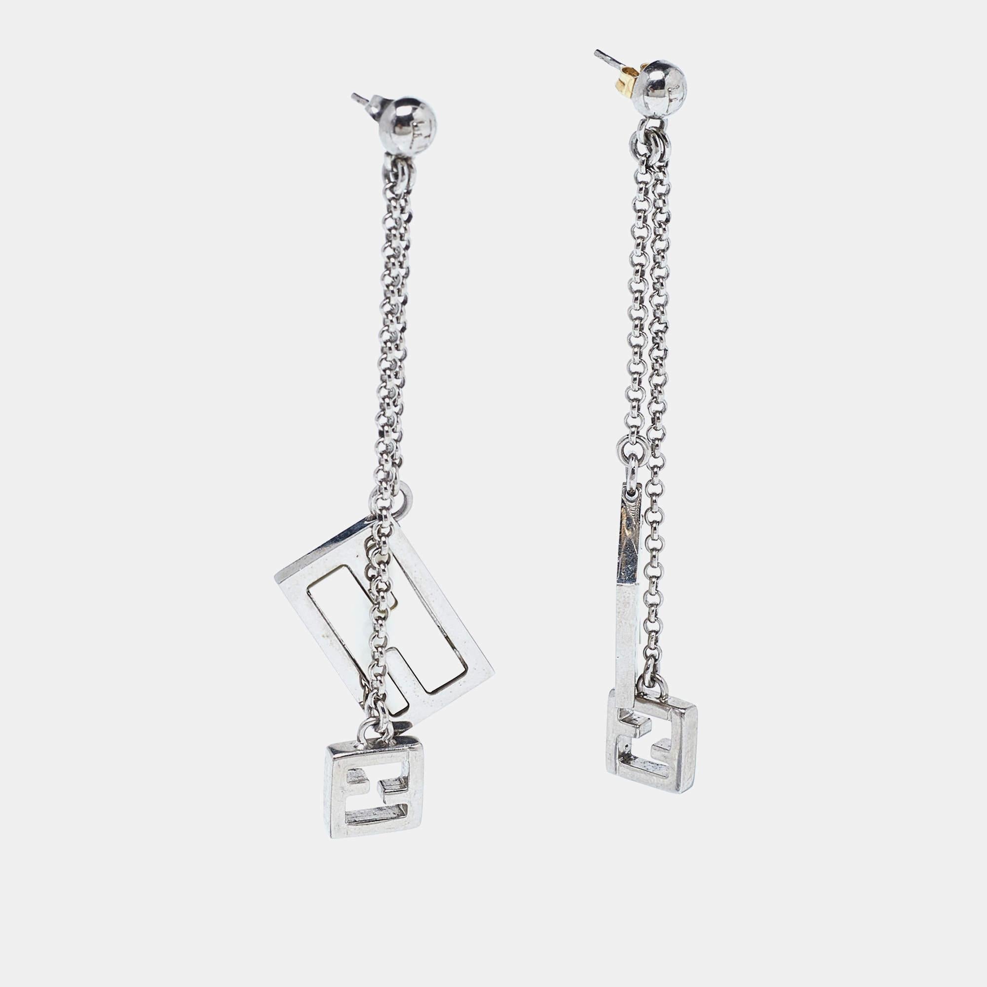 Easy to wear, beautiful, and stylish, these Fendi earrings are perfect to wear with your casual everyday edit as well as party looks. Constructed in silver-tone metal, this pair is added with brand details for a signature slant.

Includes: Original