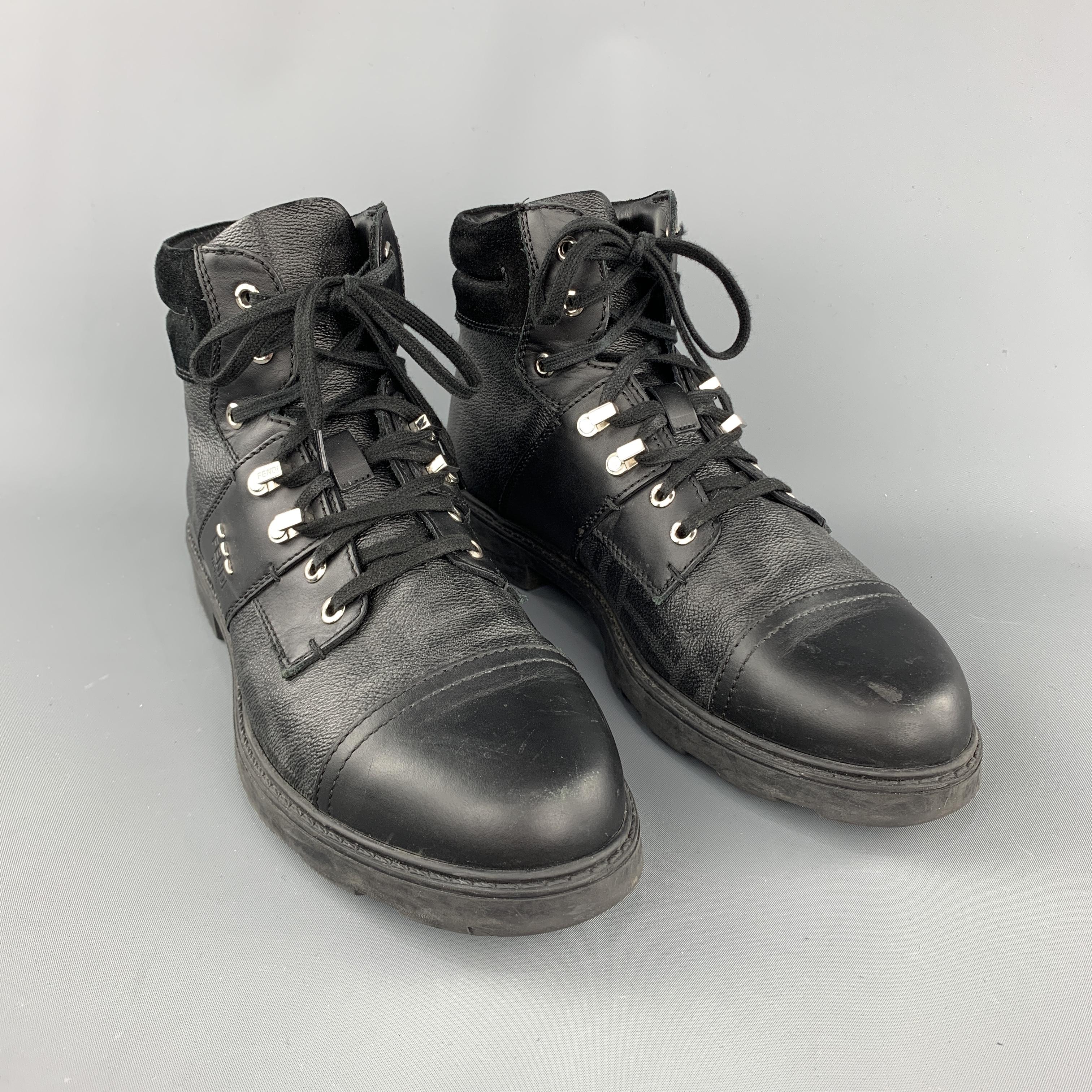 FENDI boot comes in a black monogram leather featuring a ankle lace up style, suede trim, and a rubber sole. (As-Is). Made in Italy.
 
Very Good Pre-Owned Condition.
Marked: 9
 
Measurements:
 
Length: 12.25 in.
Width: 4.5 in.
Height: 6.5 in.