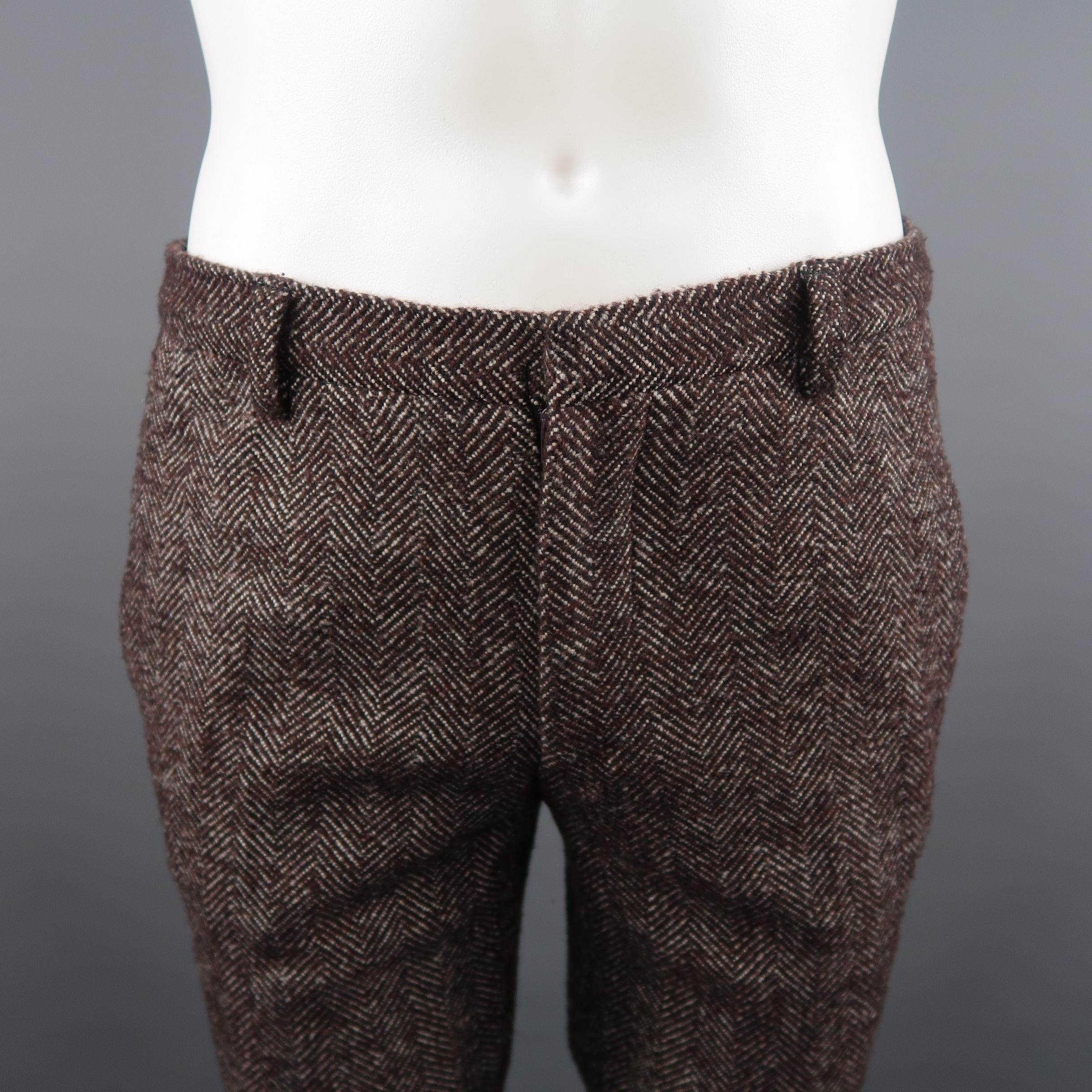 FENDI Casual Pants comes in brown and white tones in a herringbone wool blend material, with a flat front,  zip fly and seam pockets. Made in Italy.
 
Excellent Pre-Owned Condition.
Marked: 50 IT
 
Measurements:
 
Waist: 33 in.
Rise: 9.5 in.
Inseam: