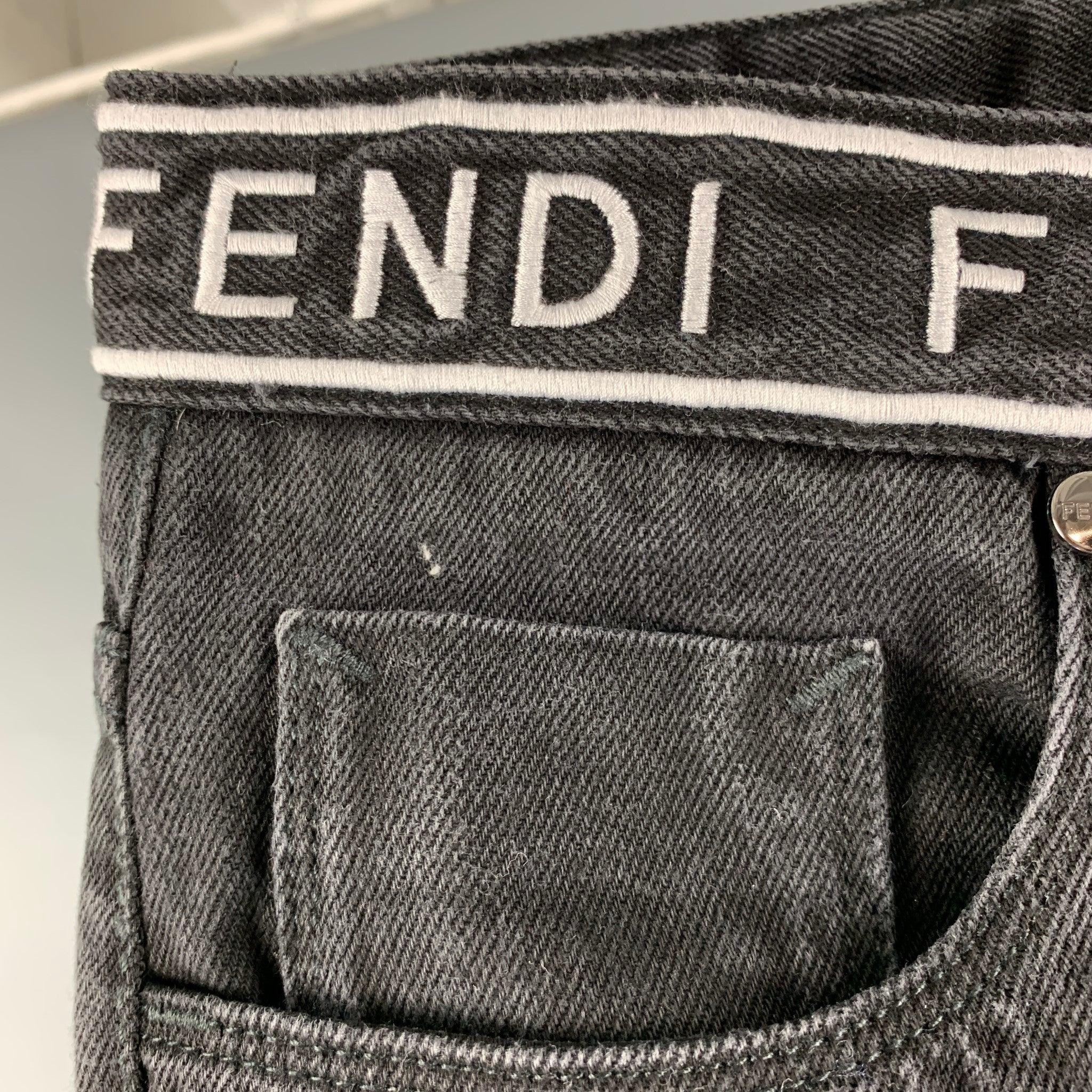 FENDI comes in a black cotton denim featuring a slim fit, logo waistband, and a zip fly closure. Made in Italy.Excellent Pre-Owned Conditions. 

Marked:   33/34 

Measurements: 
  Waist: 33 inches Rise: 9.5 inches Inseam: 32 inches  
  
  
