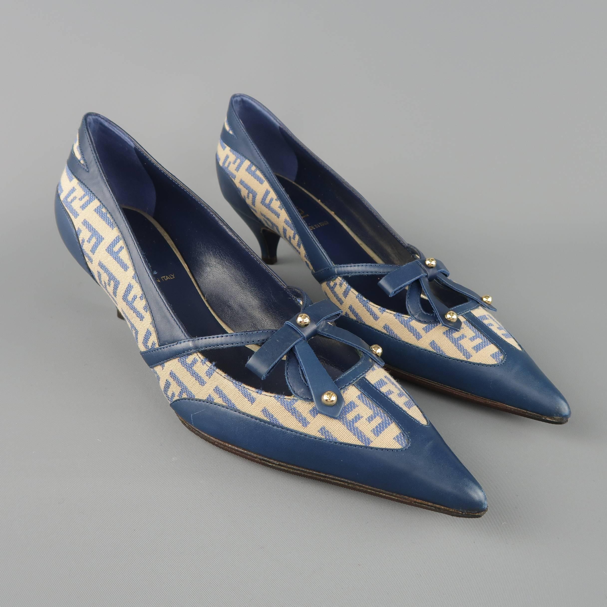Archive FENDI pumps come in navy blue leather with blue and beige Zucca monogram print canvas panels and feature a pointed toe with bow detail and covered kitten heel. Custom tope soles added. Made in Italy.
 
Good Pre-Owned Condition. Brand