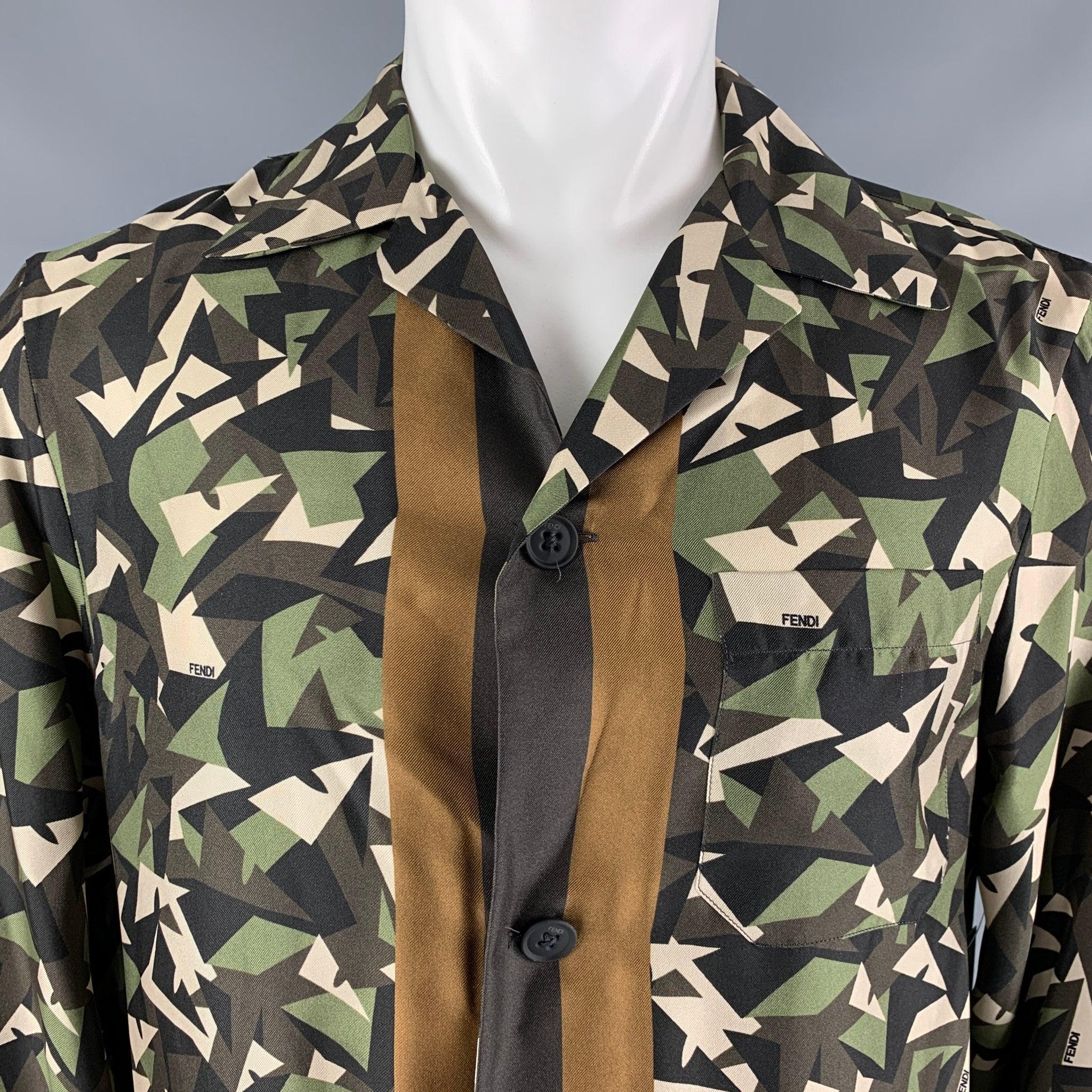 FENDI shirt comes in brown and green camouflage silk woven material with monster Fendi signature print, contrast detail, a button up closure. Made in Italy.Excellent Pre-Owned Condition. 

Marked:   40 

Measurements: 
 
Shoulder: 18 inches Chest: