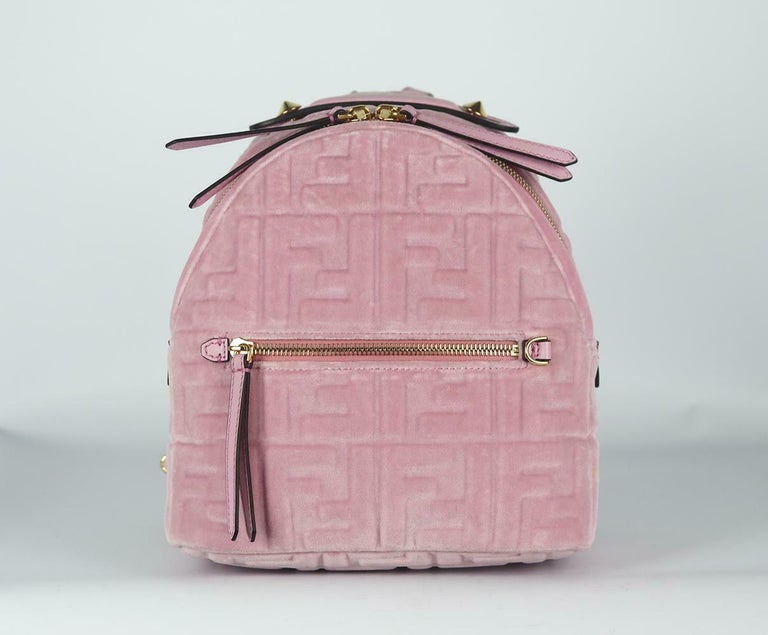 The 'FF' emblem is still one of the industry's most enduring logos, this small backpack has been made in Italy from plush velvet and has durable leather trims, including the elongated zipper pulls and adjustable straps.
Pink velvet, pink leather.