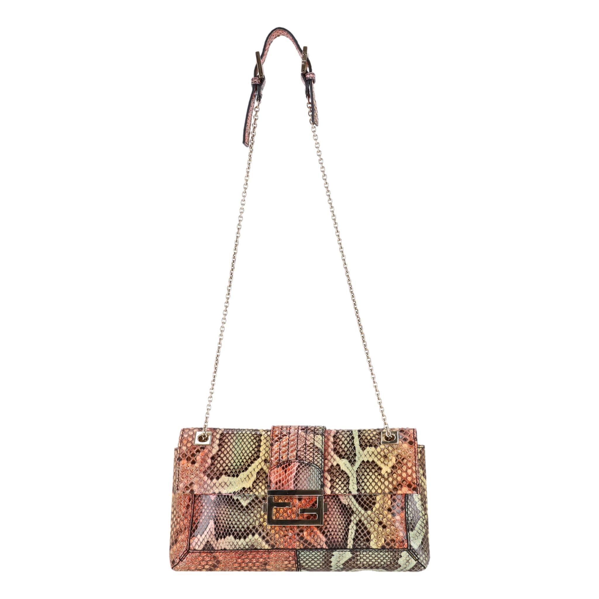 Fendi Snakeskin Maxi Baguette Shoulder Bag

Maxi baguette shoulder bag crafted in vibrant multicoloured snakeskin.

Featuring gold hardware with signature 'FF' buckle front flap and chain shoulder straps with adjustable snakeskin shoulder