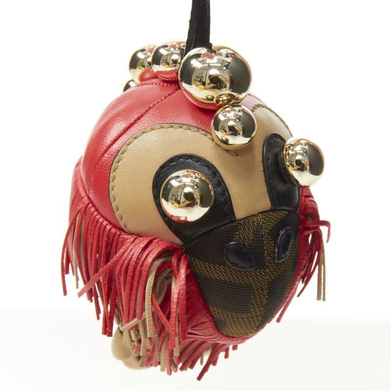 FENDI Space Monkey Zucca FF monogram red fringe gold stud keyring bag charm
Reference: ANWU/A00115
Brand: Fendi
Collection: Space Monkey
Material: Canvas, Leather
Color: Brown, Red
Pattern: Monogram
Closure: Clasp
Extra Details: Brown Zucca FF